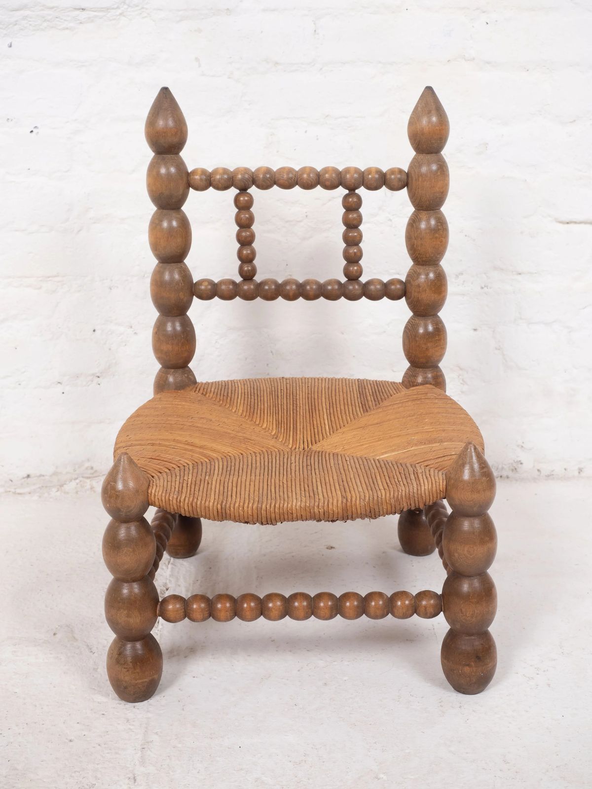 Vintage Low Bobbin Chair In The Style Of Charles Dudouyt photo for sale