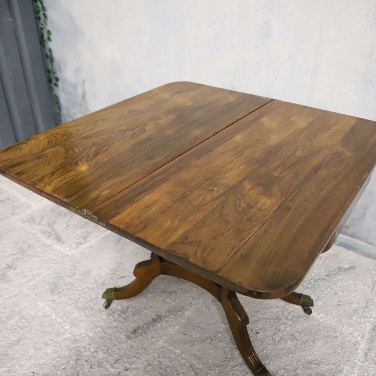 photo vintage Regency Rosewood Tea Table With Fold Over Top And Original Brass Castors