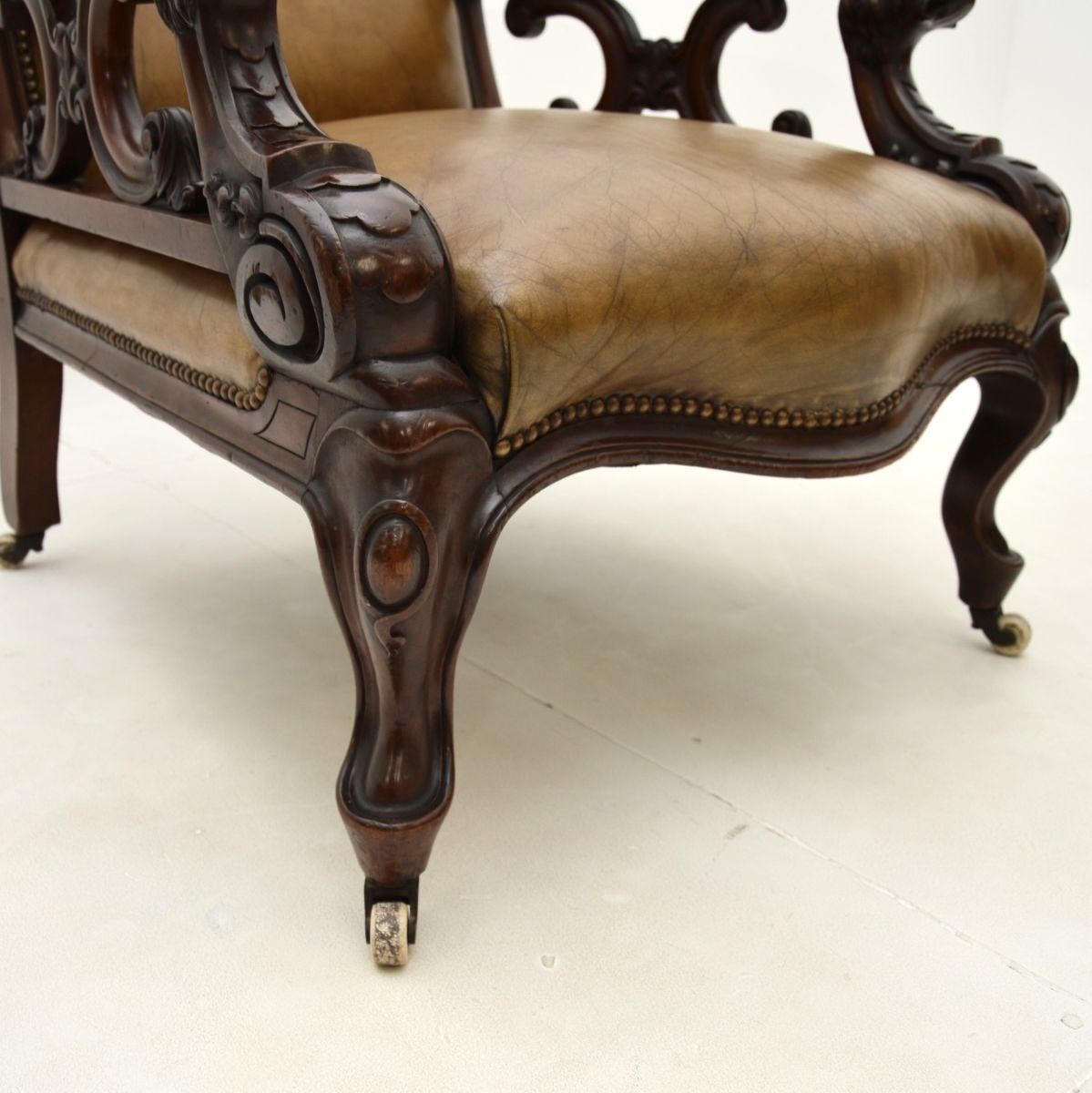 3250.0 Antique Victorian Carved Mahogany And Leather Armchair photo