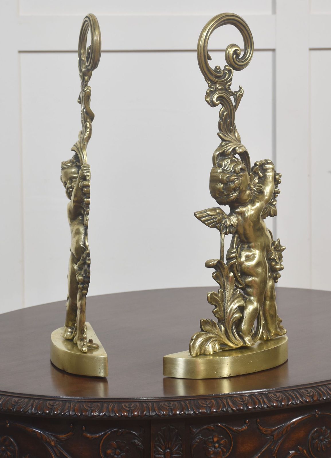 Pair Of Brass Putti Door Stops photo Home Fixtures