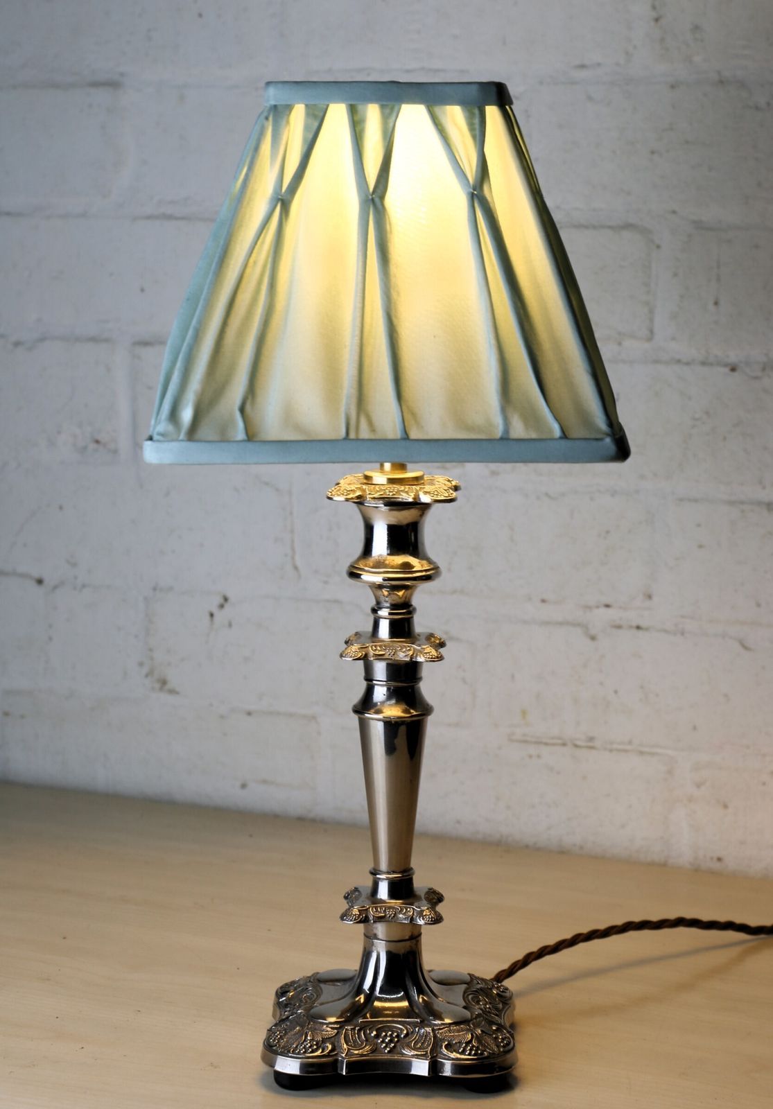 105.0 A Vintage Silver Plated Table Lamp With Ornate Castings With A Pale Sage Pinch Pleated Lampshade photo
