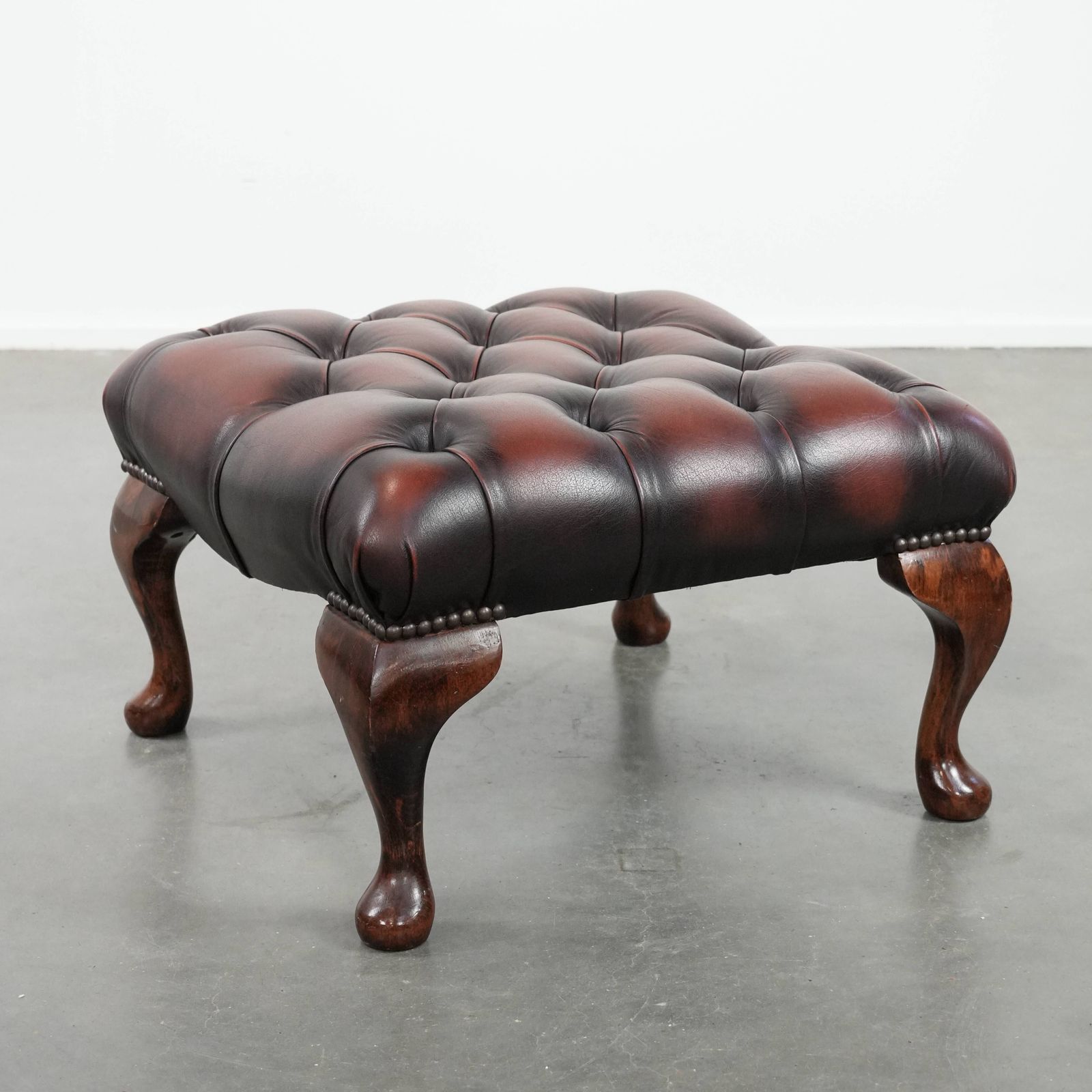 Elegant And Graceful Dark Brown Chesterfield Footstool Made Of Cowhide