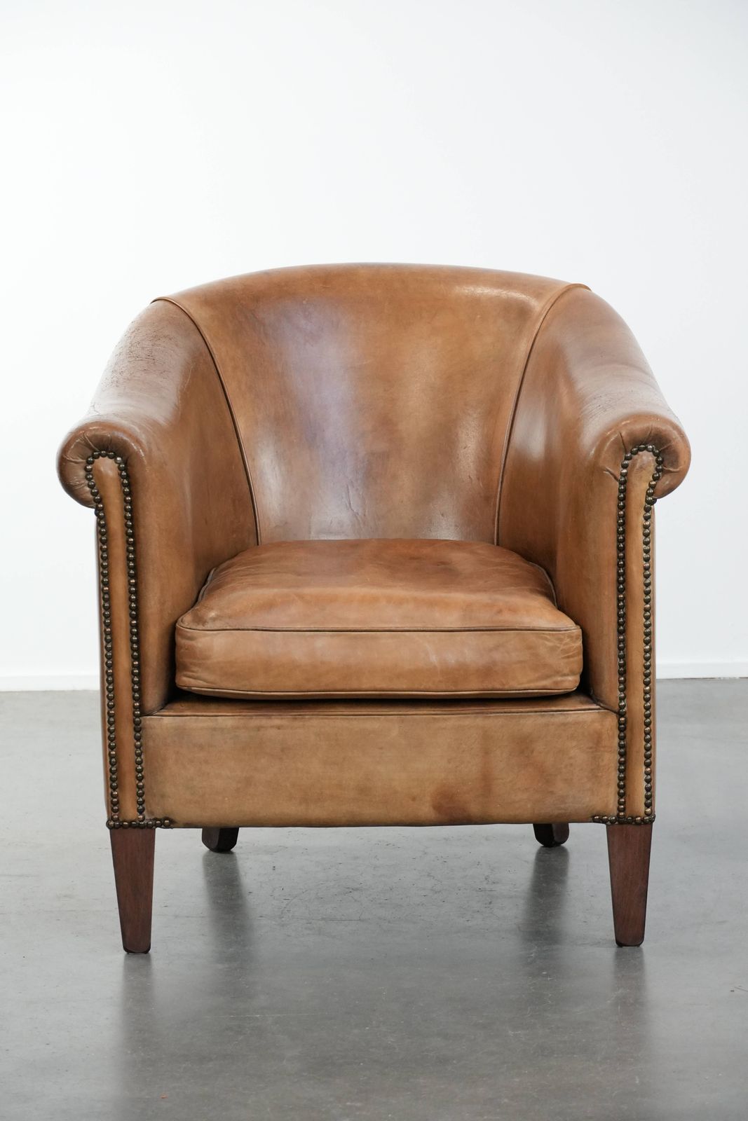 Characterful Club Armchair Made Of Sheepskin With Beautiful Light Cognac Colors photo furniture