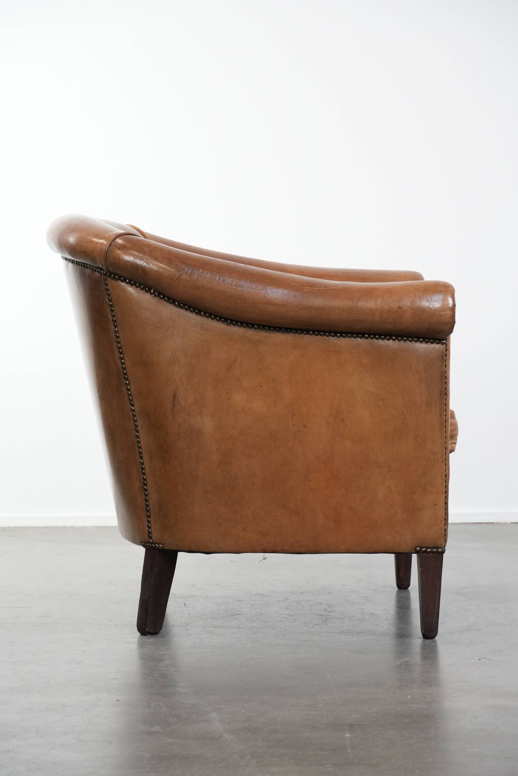 Characterful Club Armchair Made Of Sheepskin With Beautiful Light Cognac Colors photo for sale