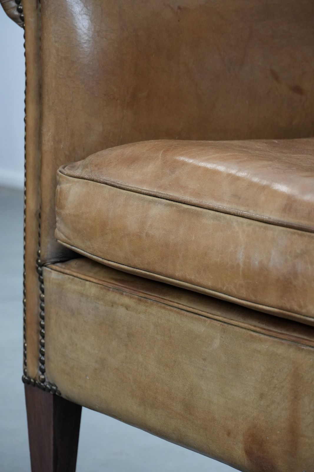 photo vinterior Characterful Club Armchair Made Of Sheepskin With Beautiful Light Cognac Colors