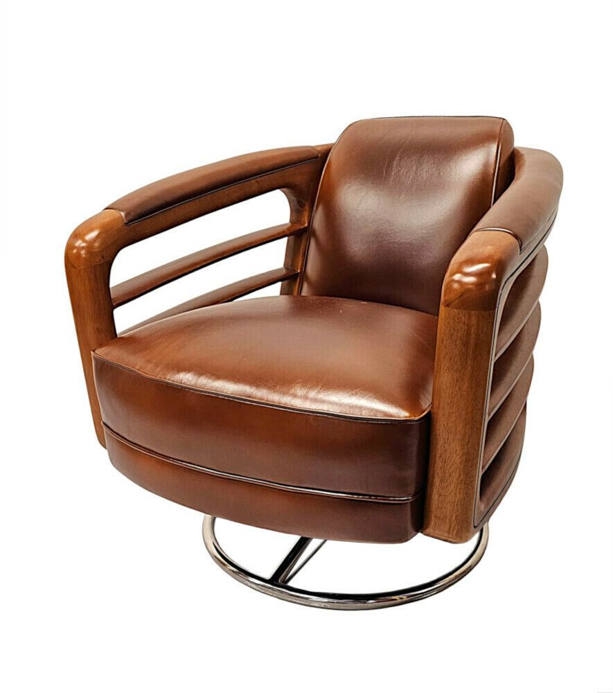 A Fabulous Hand Made Leather And Chrome Revolving Club Chair