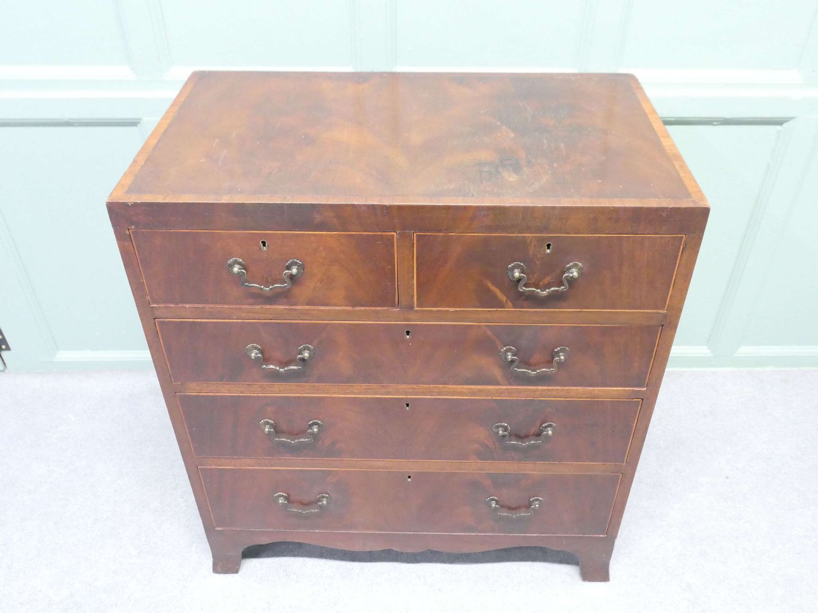A Medium Size Flame Mahogany Georgian Style Chest Of Drawers photo for sale