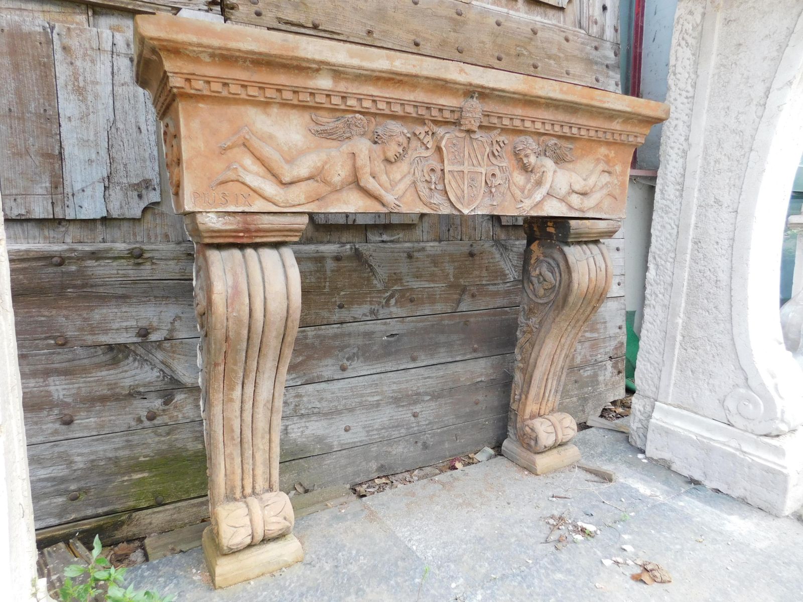 Fireplace Mantle In Terracotta Carved With Cherubs, Italy photo for sale