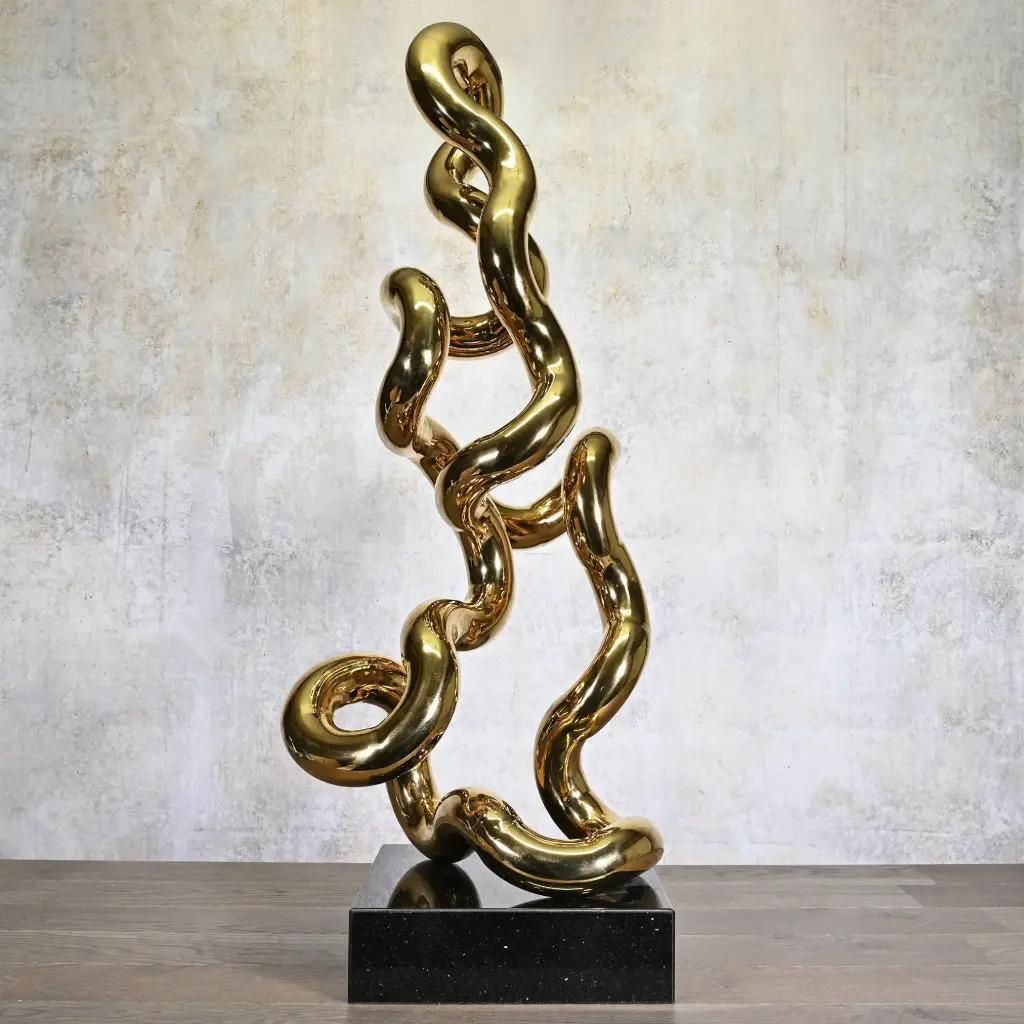 Gold Tubular Metal Sculpture On Black Base, Contemporary Style photo furniture
