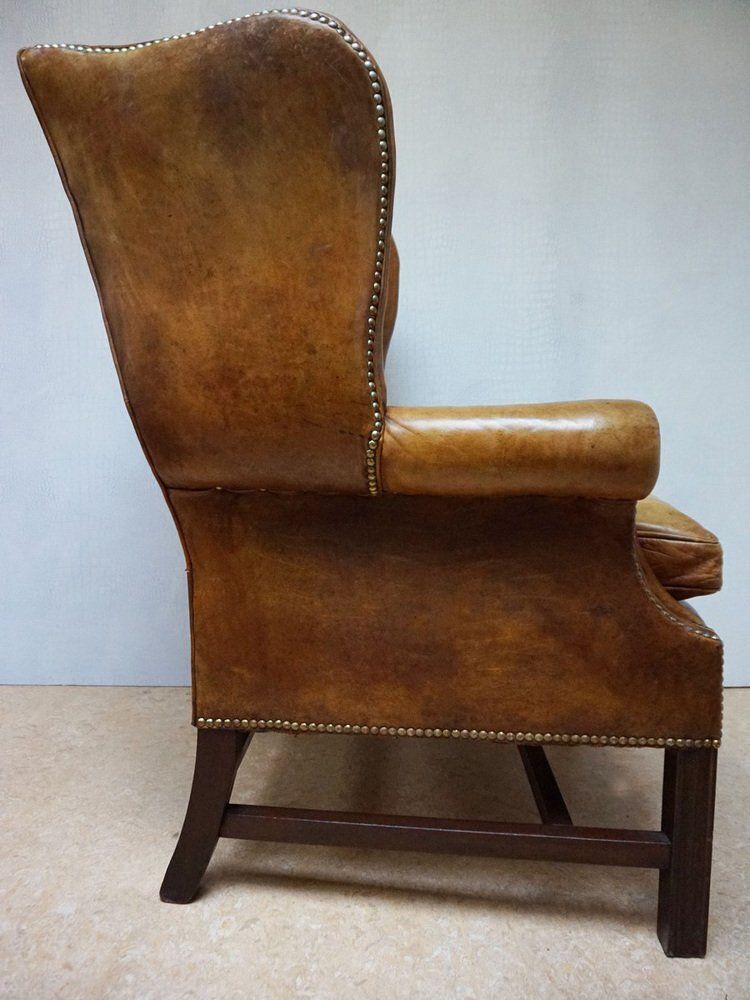 photo furniture Mid Century Cognac Leather Chesterfield Wingback Armchair, 1960s