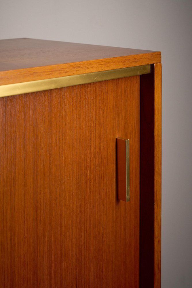 Teak Cabinet With Brass Details And Black Metal Base, 1970s photo vintage