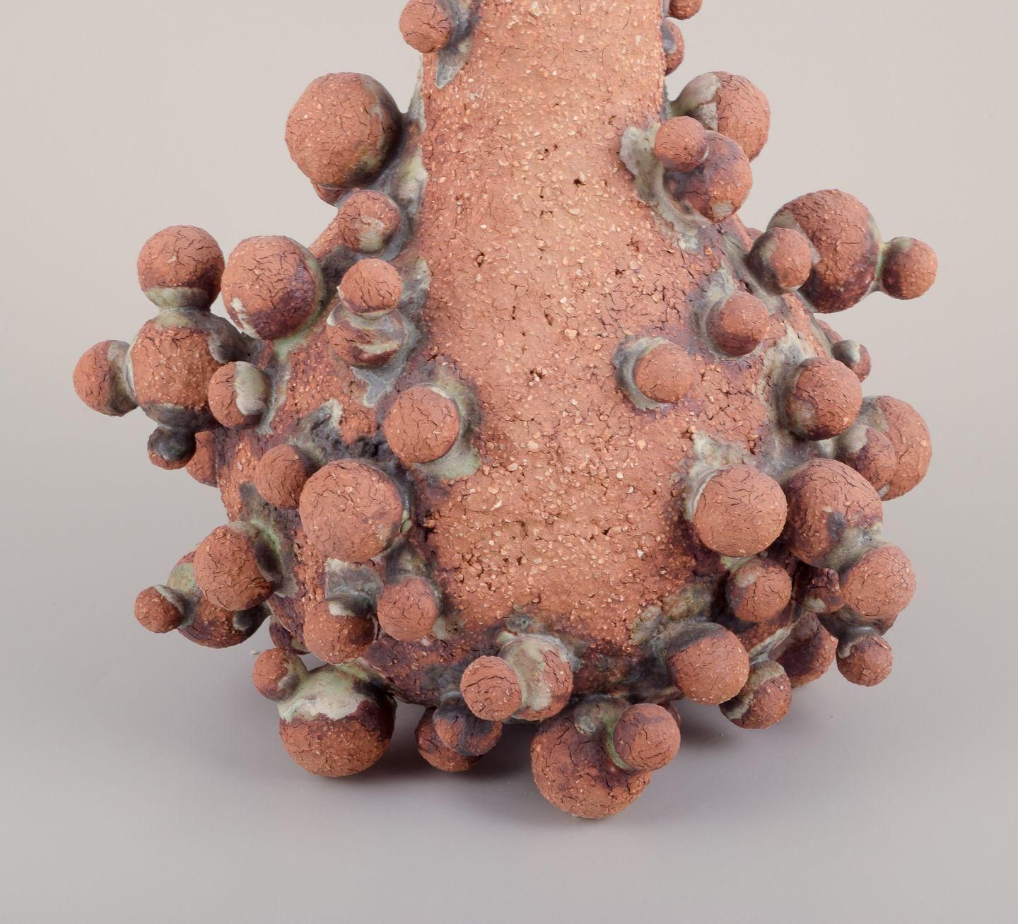 Christina Muff, Contemporary Danish Artist. Tall Vessel Covered In Clay Balls. photo for sale
