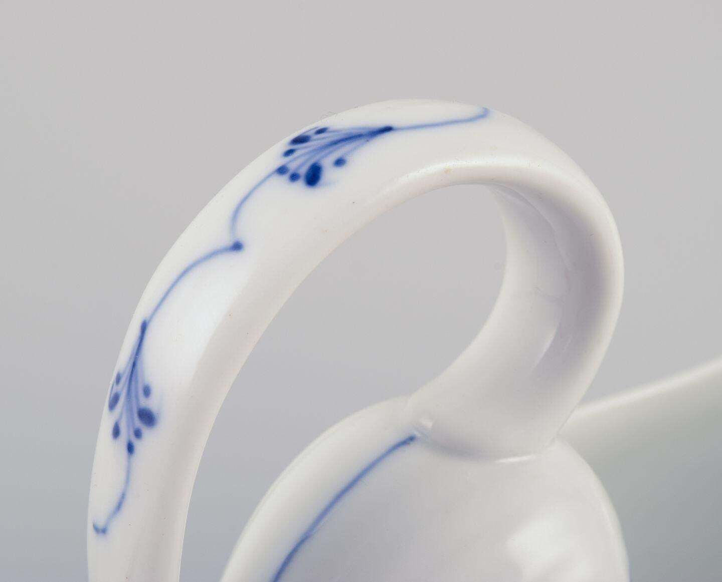photo furniture Royal Copenhagen Blue Fluted Plain. Antique Gravy Boat In Porcelain.