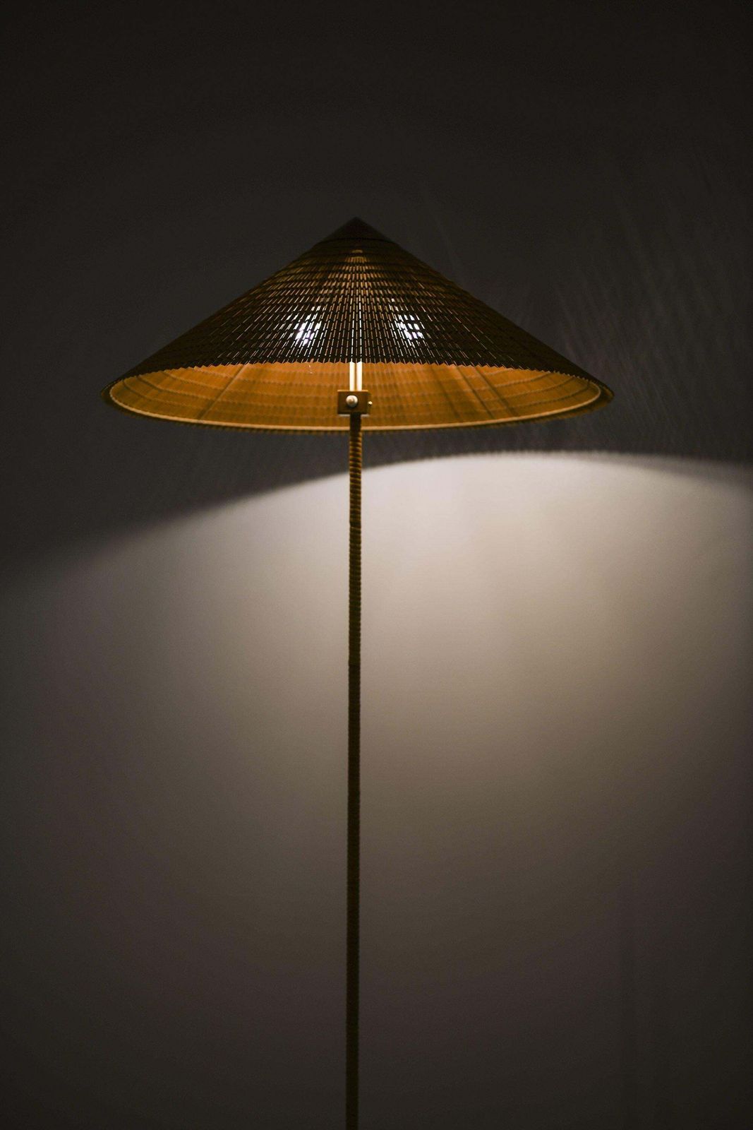 Pair Of Floor Lamps In Brass, Cane And Cane Shades By Paavo Tynell, 1950's photo for sale