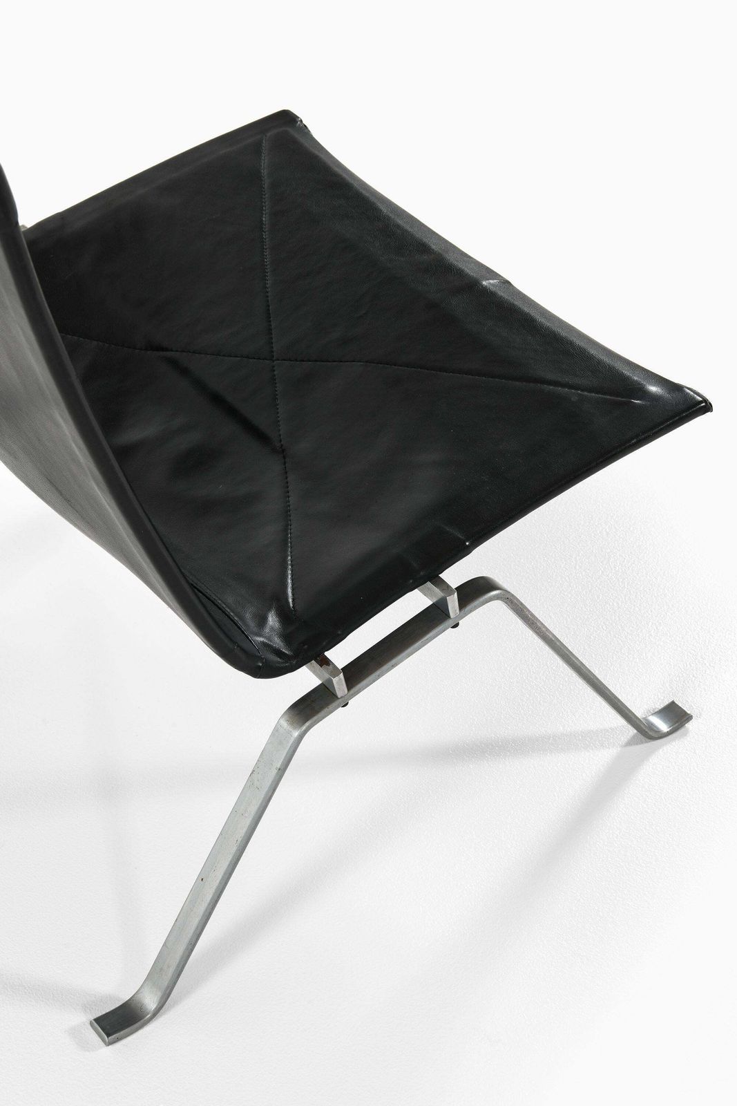 Pair Of Easy Chairs In Black Leather And Steel By Poul Kjærholm, 1950's photo vinterior