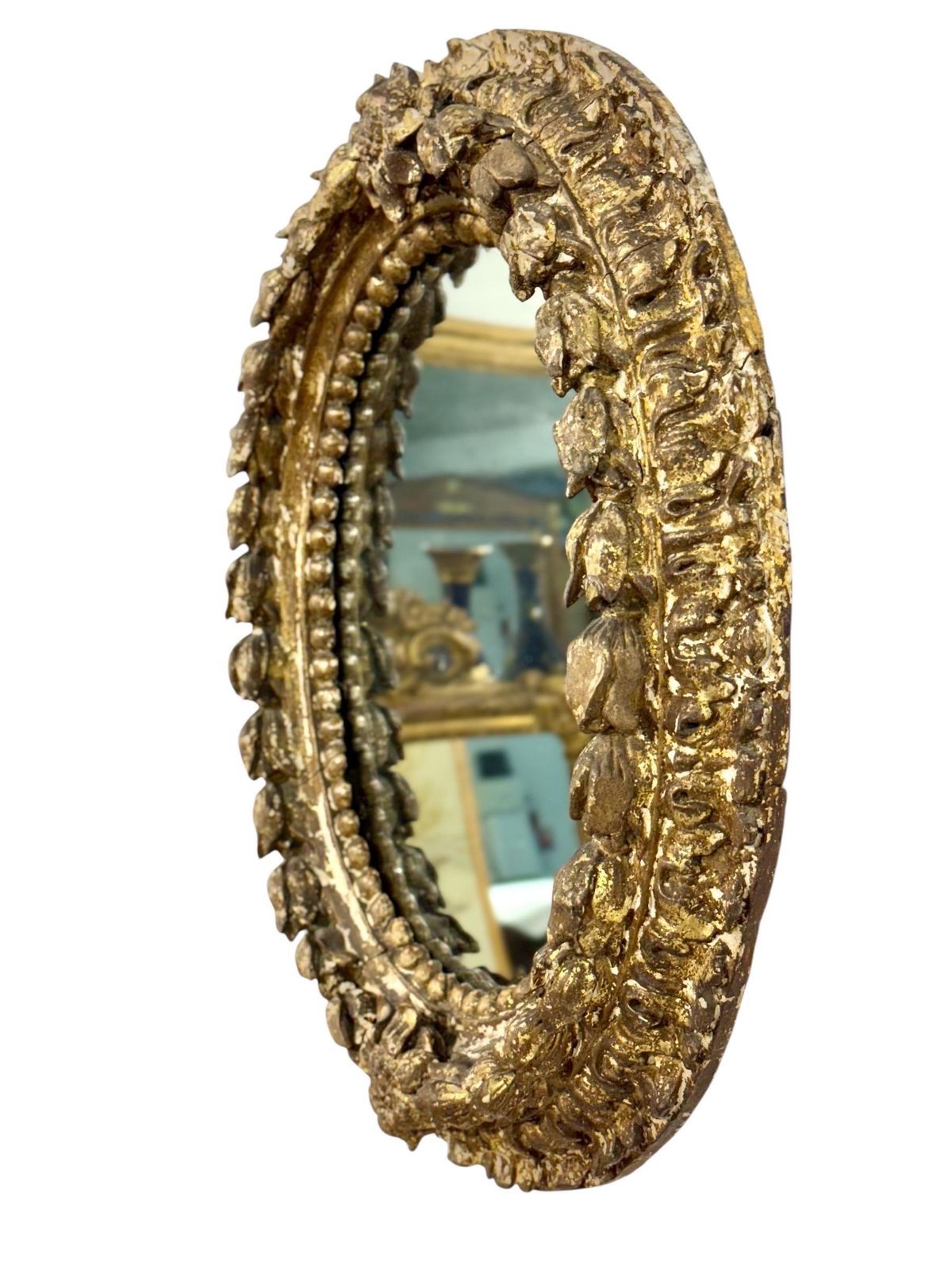 photo for sale 17th Century Italian Oval Giltwood Mirror With Floral Carvings