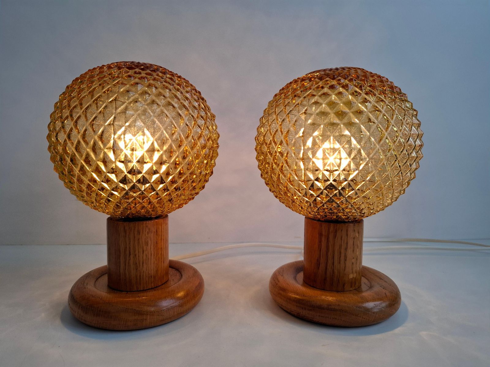 photo for sale Pair Of Mid Century Table Lamps With Amber Glass And Wood Base, Czechoslovakia