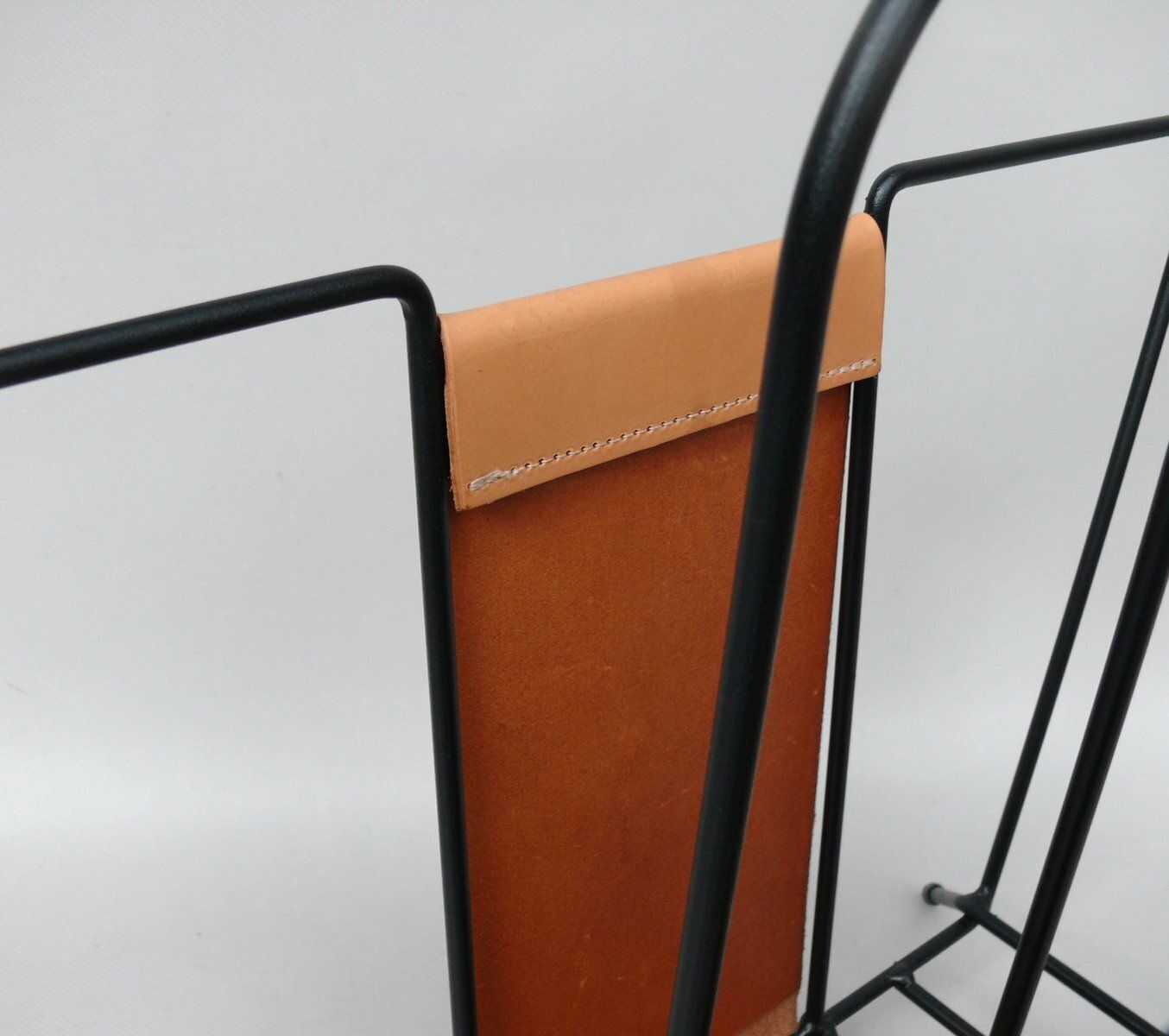 Mid Century Magazine Rack In String Steel Painted Black & Light Leather In The Style Of Jacques Adnet, 1960s photo vintage