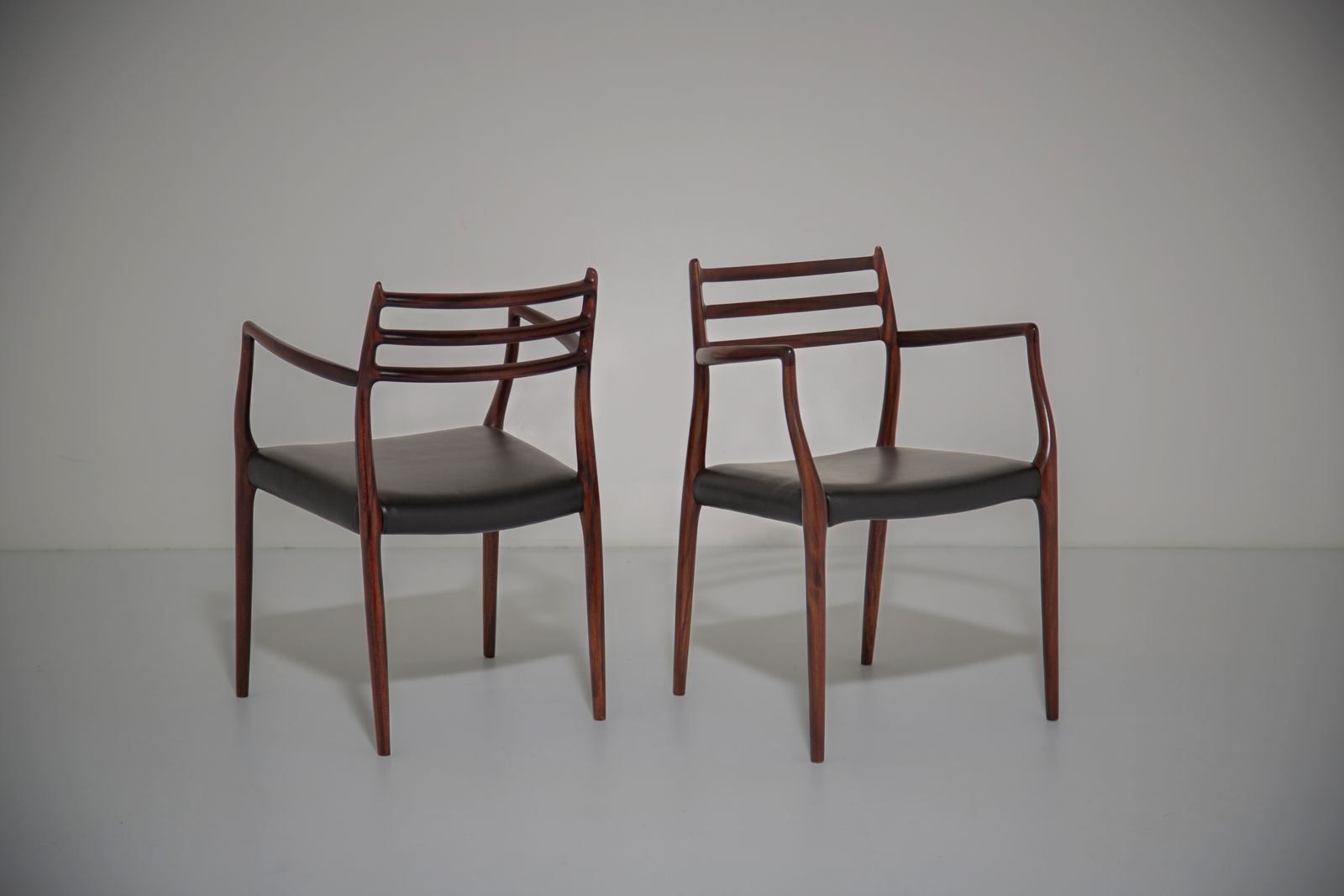 Niels Otto Møller Model 62 Carver Armchairs: Solid Mahogany For J.L. Møllers, 1960s.
