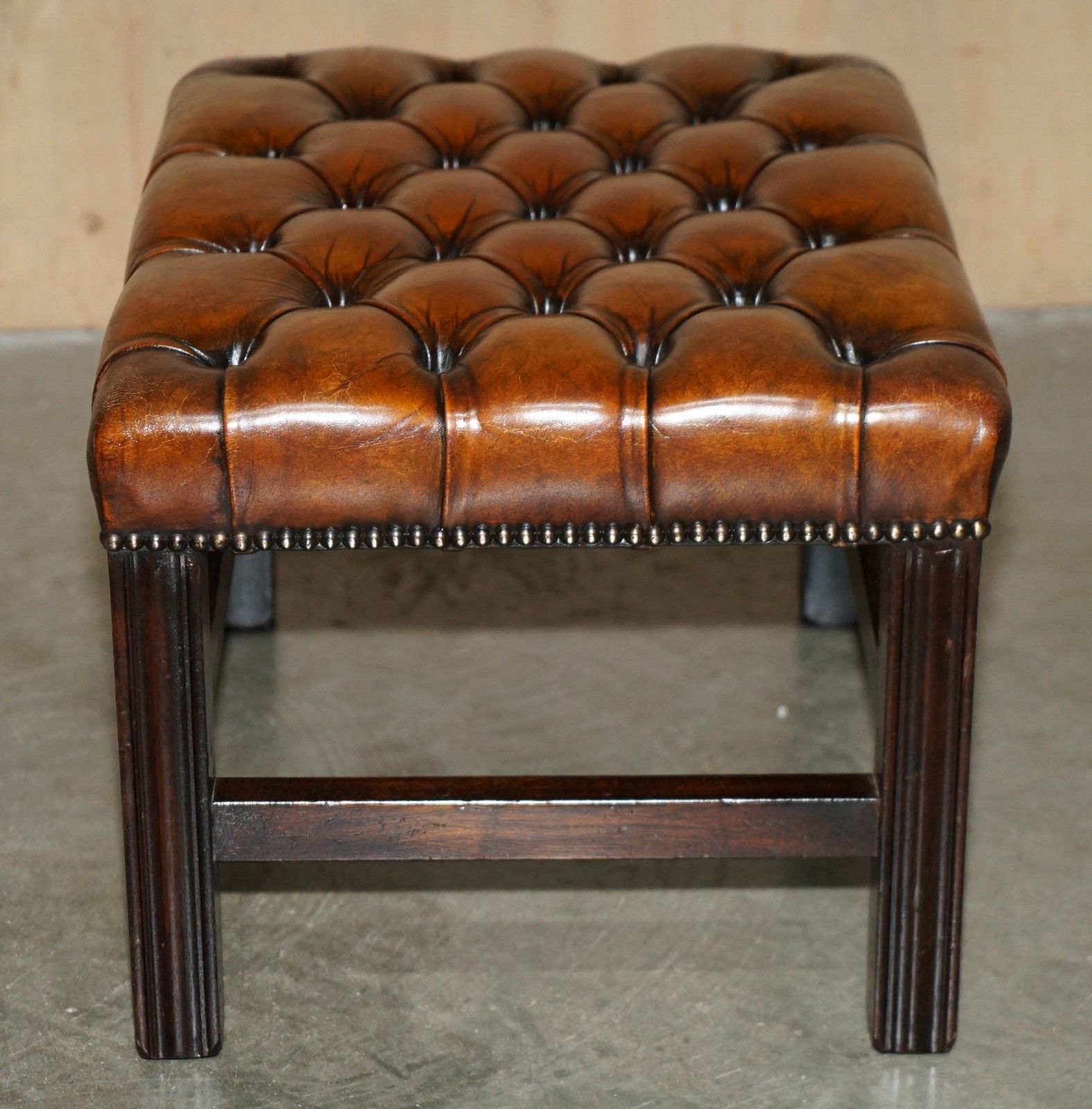 2950.0 Pair Of Restored Vintage Hand Dyed Brown Leather Chesterfield Tufted Footstools photo