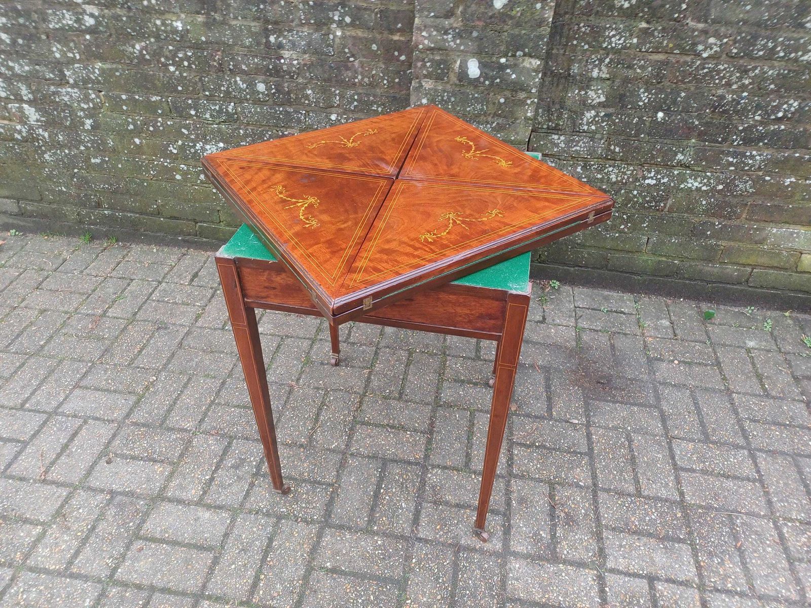photo vintage Victorian Mahogany Games Table Folding Swivel Top Card Table Ribbon Inlay Brass Porcelain Casters Antique Side Table Free Hand Delivery