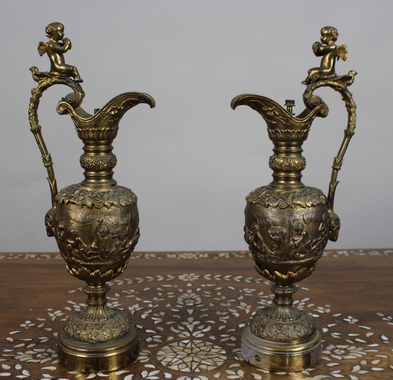 Pair Of 19th Century French Gilt Bronze Bacchanalian Ewers With Cherubs