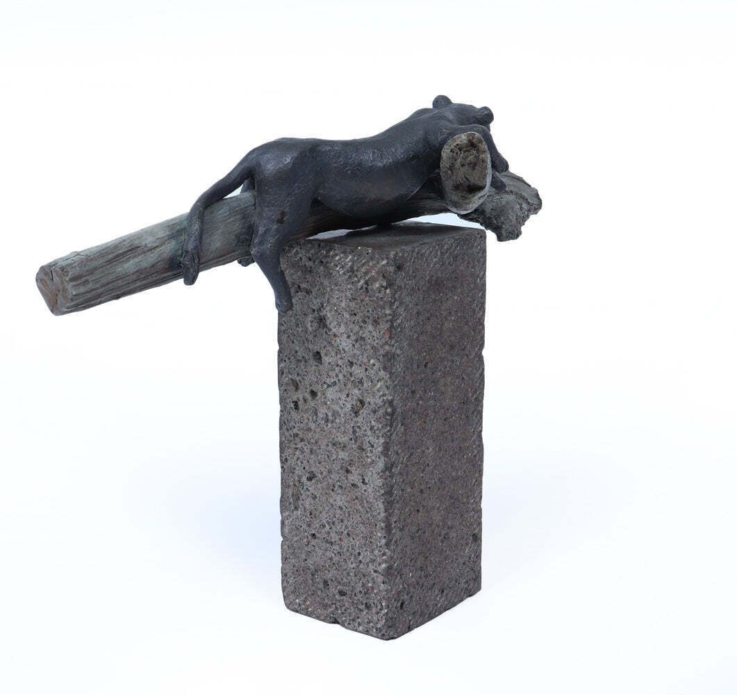 Bronze Sculpture Of A Resting Lioness On Cold Painted Log photo for sale