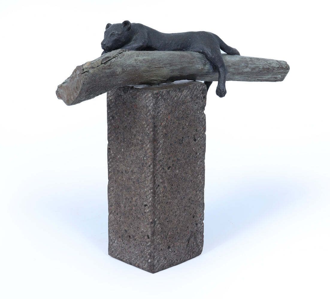 Bronze Sculpture Of A Resting Lioness On Cold Painted Log photo buy