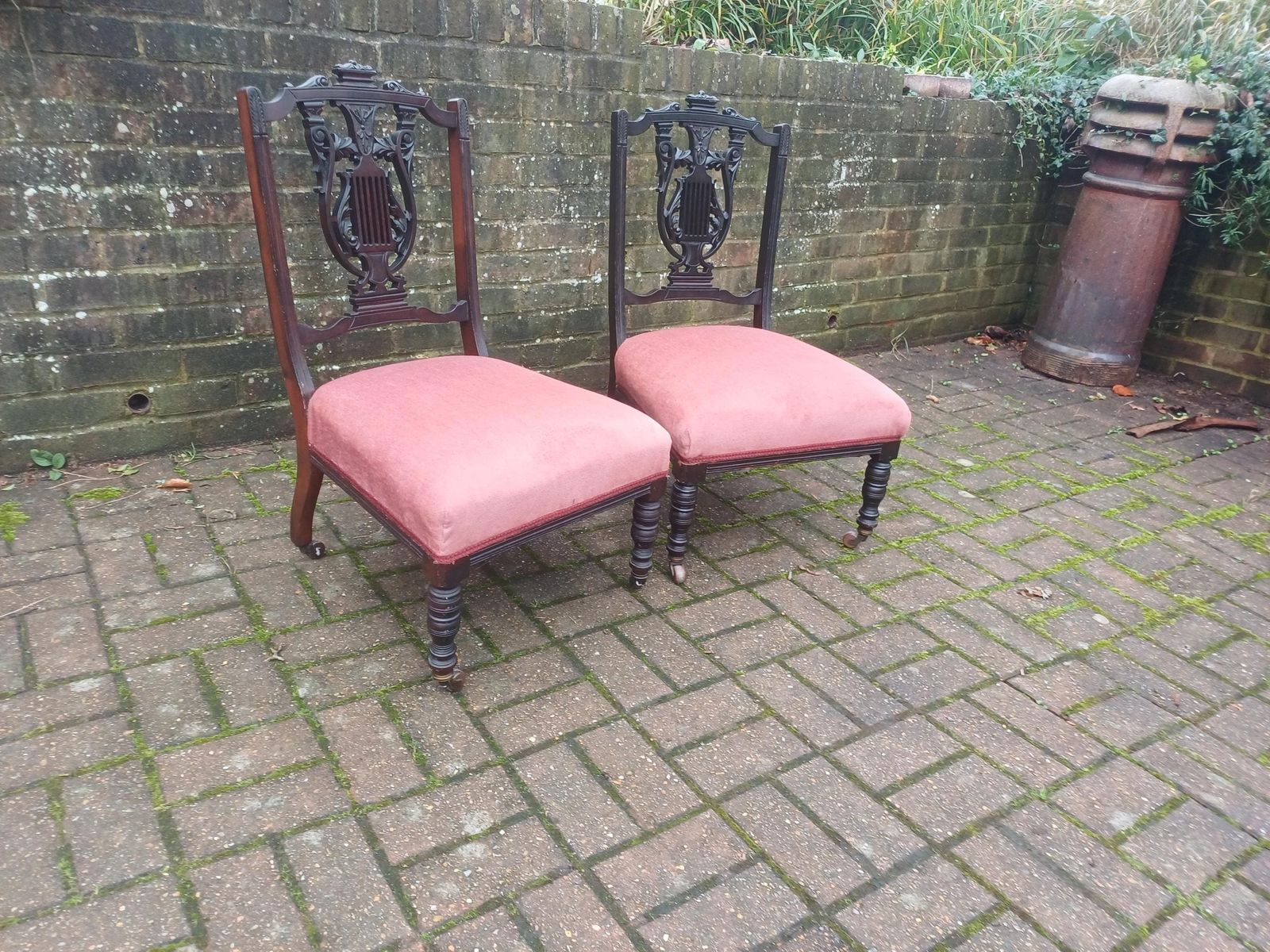 Pair Victorian Mahogany Occasional Chairs Ebonised Finish Carved Fretwork Backs Turned Legs Porcelain Castors Pink Seats photo vintage