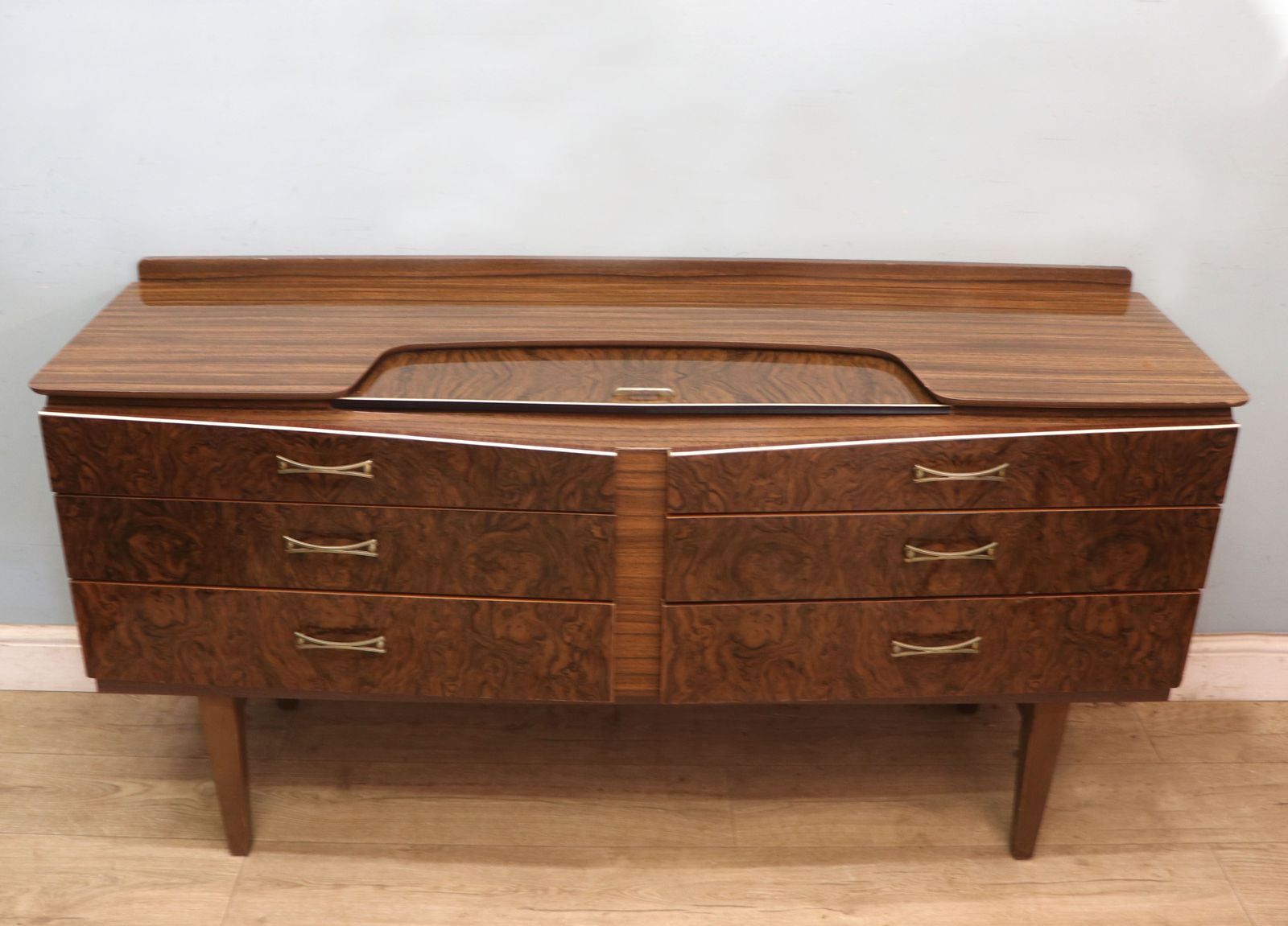 A Super Vintage Mid Century, Wide Chest Of Drawers With A Walnut Effect Melamine Finish.
