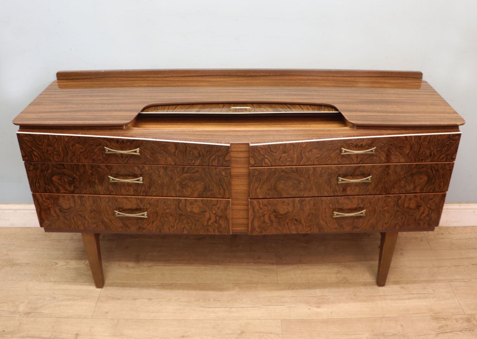 A Super Vintage Mid Century, Wide Chest Of Drawers With A Walnut Effect Melamine Finish. photo for sale
