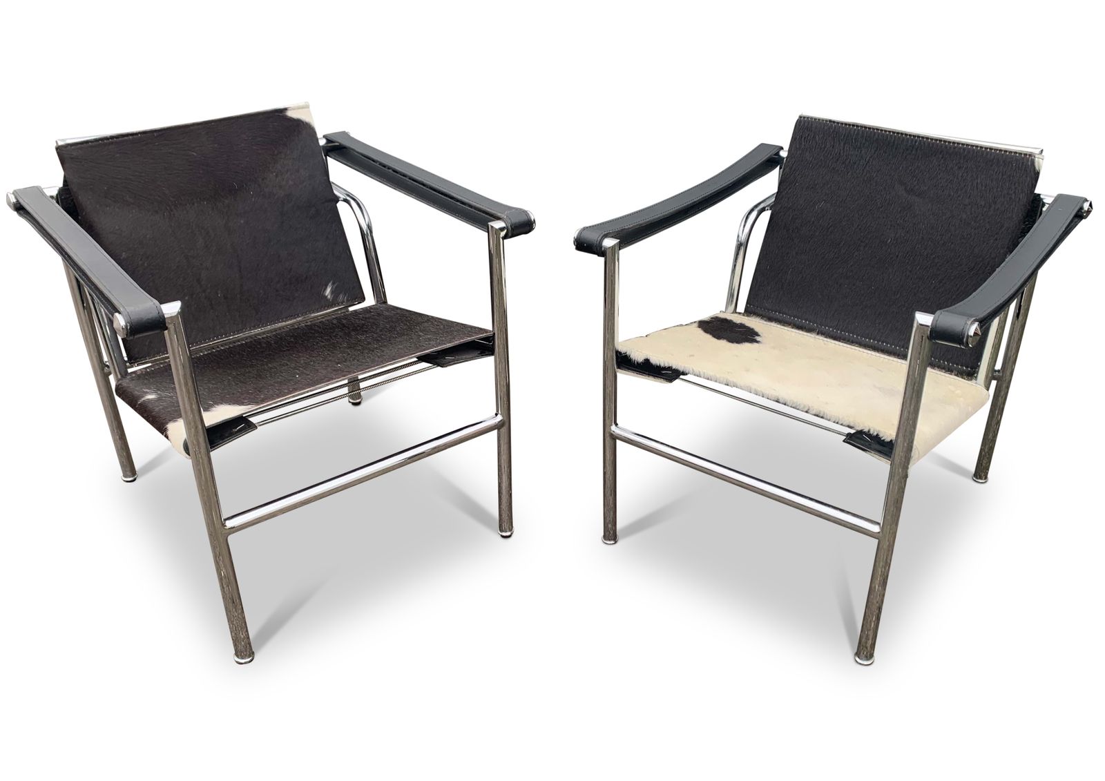 A Pair Of Le Corbusier Style Lc1 Pony Skin Sling Armchairs With Chromed Tubular Frame No Labels Or Markings Circa 1980s/1990s