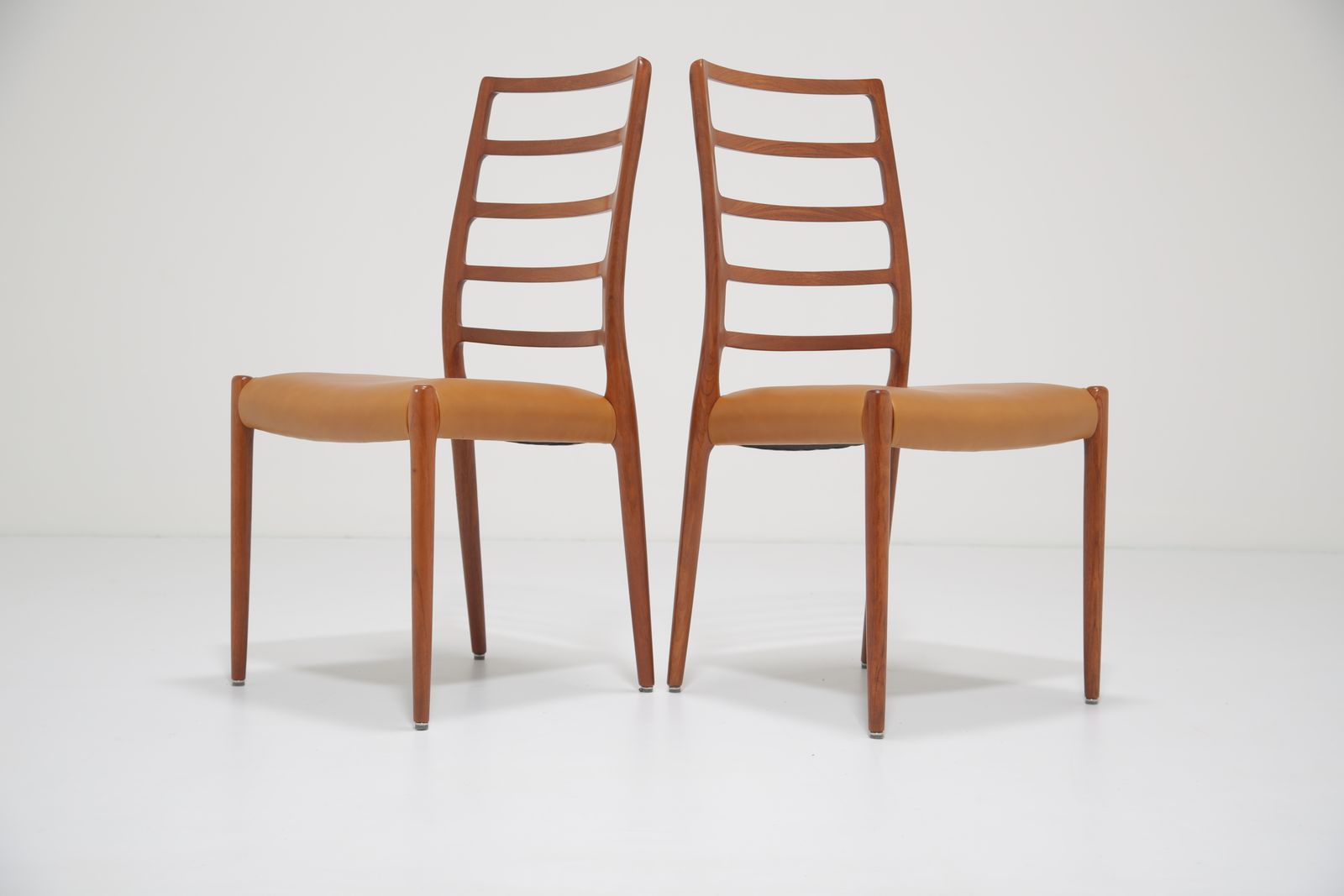 photo for sale Niels Otto Møller Model 82 Dining Chairs: Set Of 8 In Solid Teak And Tan Leather For J.L. Møllers, 1960s