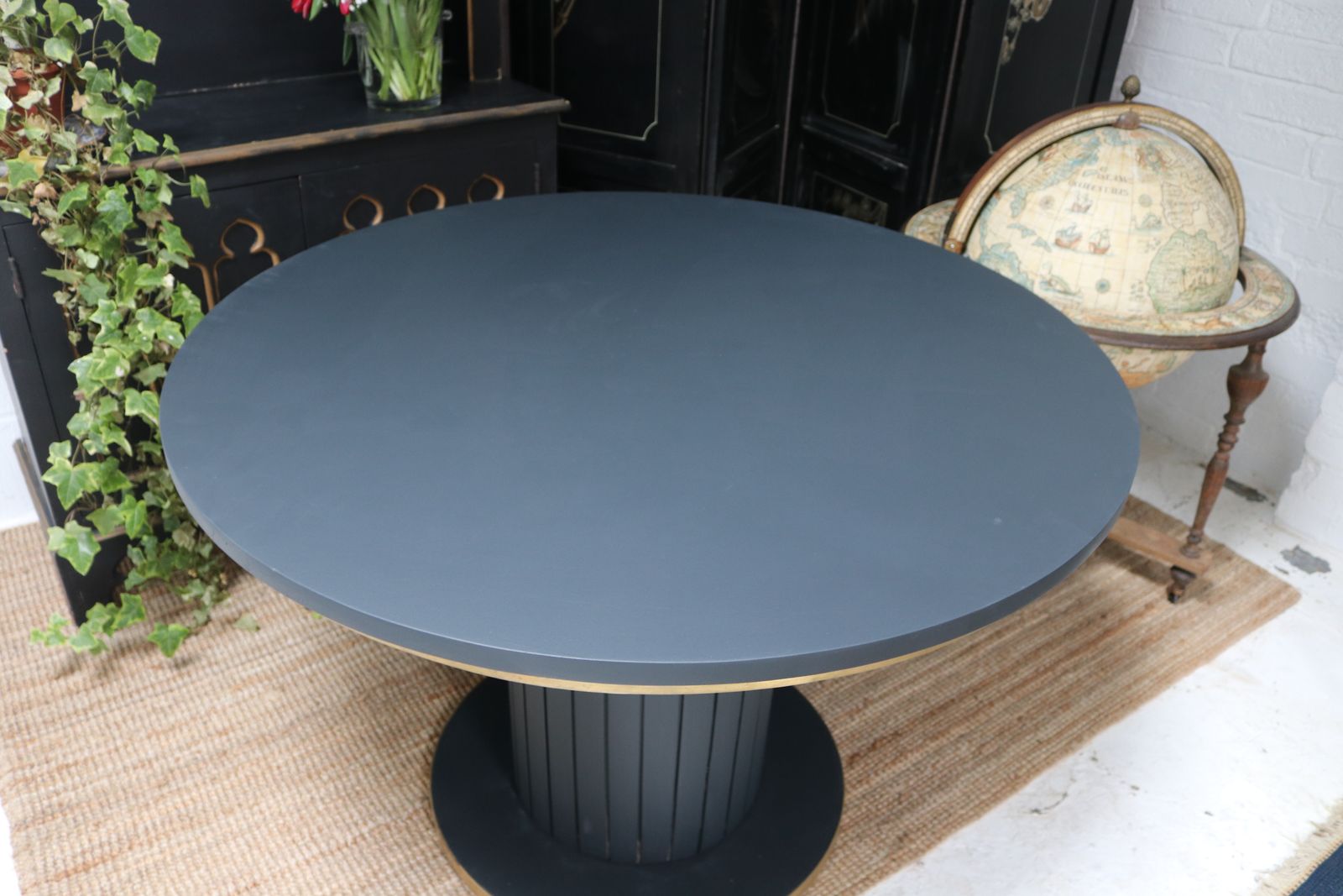 Stunning Black Round Dining Table With Brass Metal Edge Slatted Wood Column Base photo Furniture
