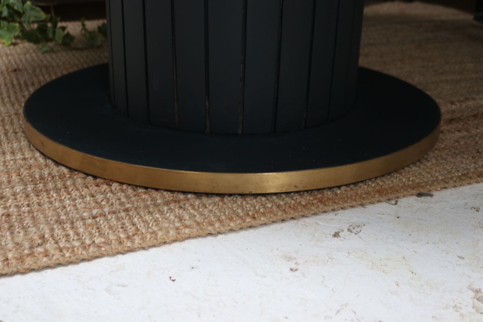 Furniture Stunning Black Round Dining Table With Brass Metal Edge Slatted Wood Column Base photo