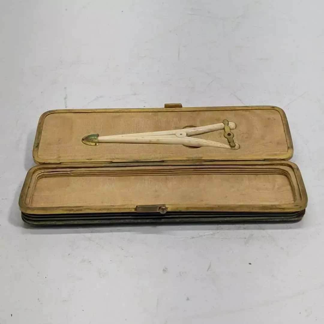 Green Moroccan Gusseted Box Containing A Pair Of Pliers photo furniture