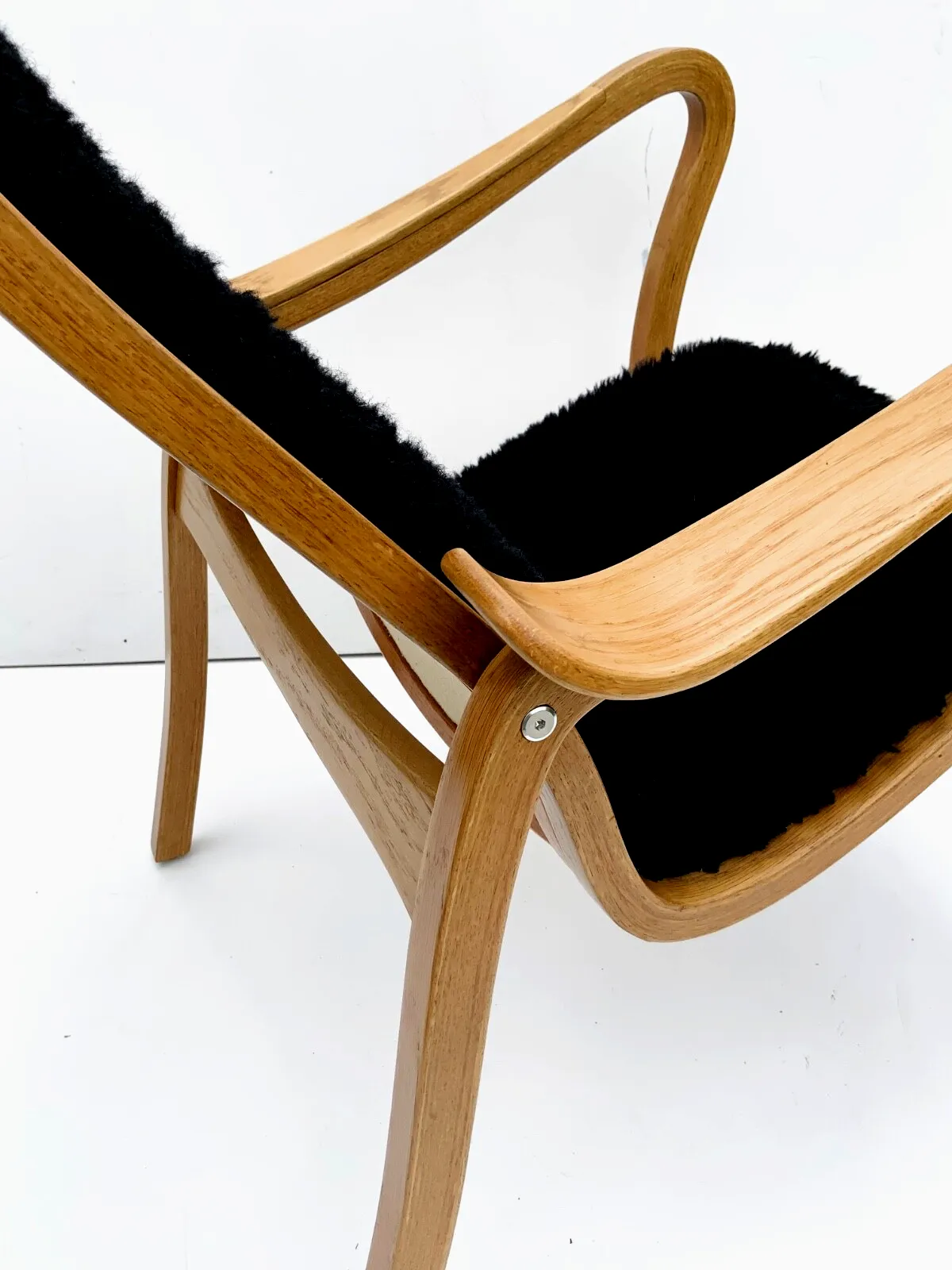 photo for sale Vintage G.A. Berg “Torparen” Armchair, Oak, Black Sheepskin, With Ottoman 1960s