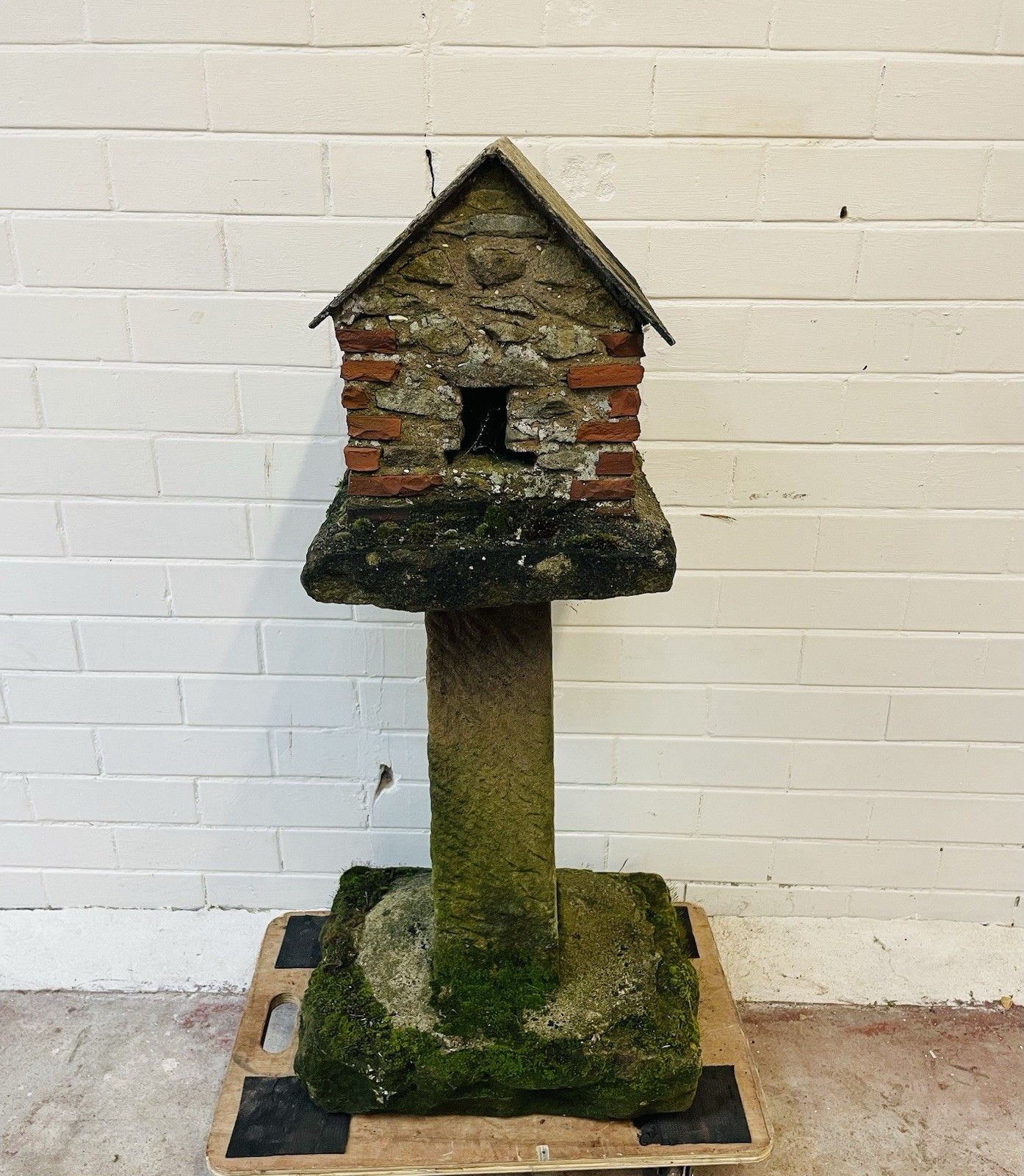 A Charming Folk Art Stone Garden Birdhouse Made From Stone. photo furniture