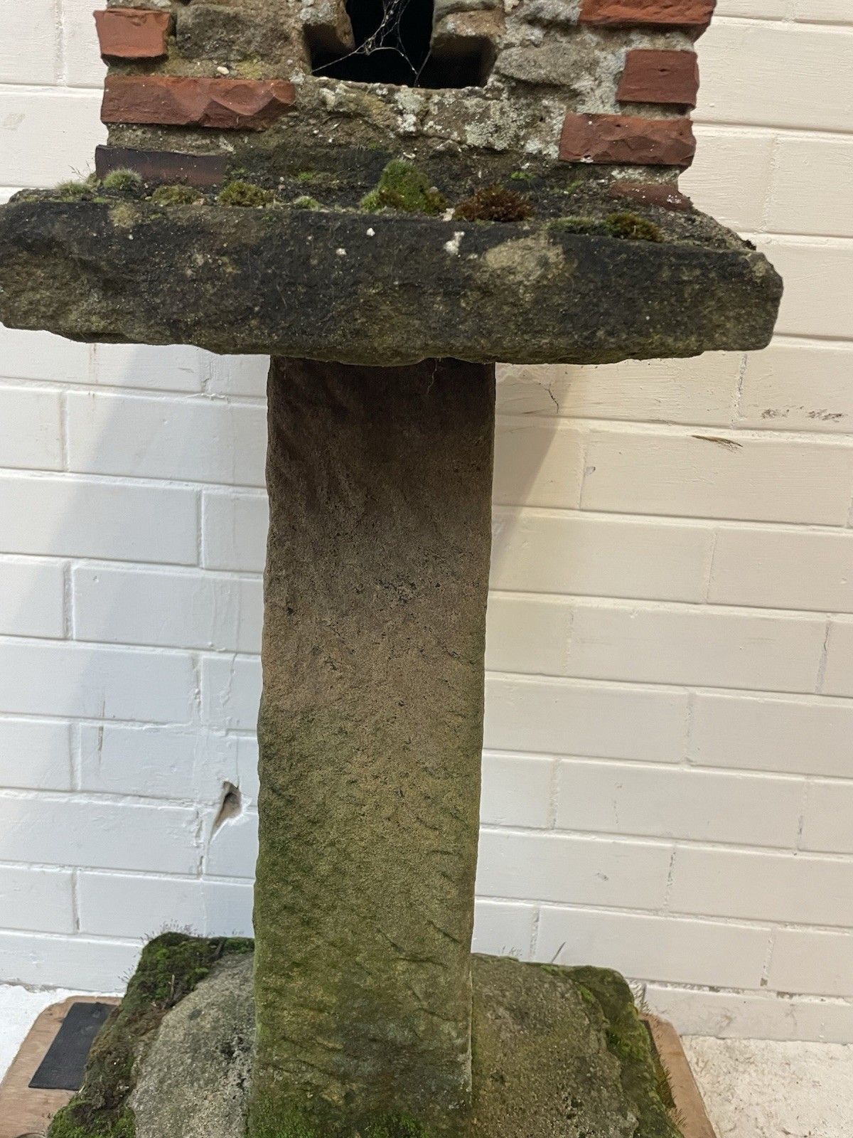 A Charming Folk Art Stone Garden Birdhouse Made From Stone. photo vinterior