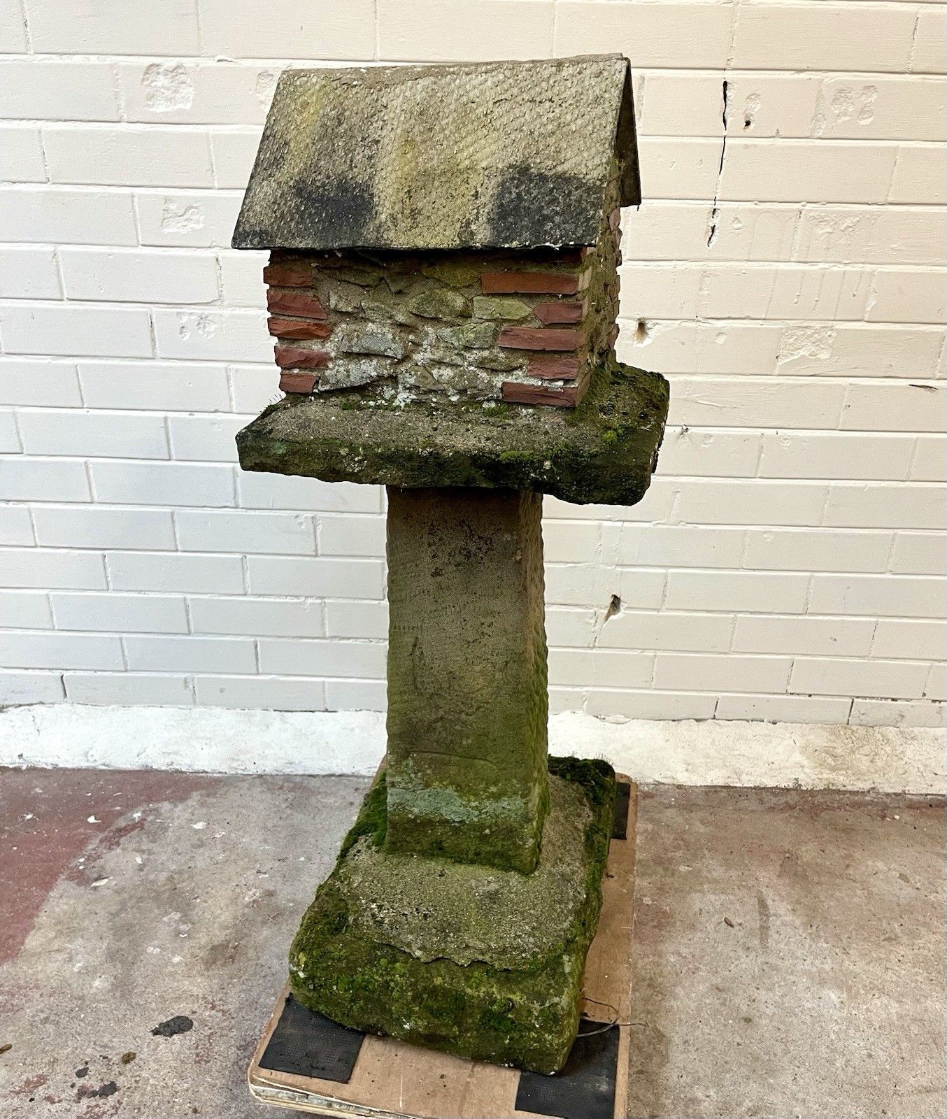 A Charming Folk Art Stone Garden Birdhouse Made From Stone. photo buy