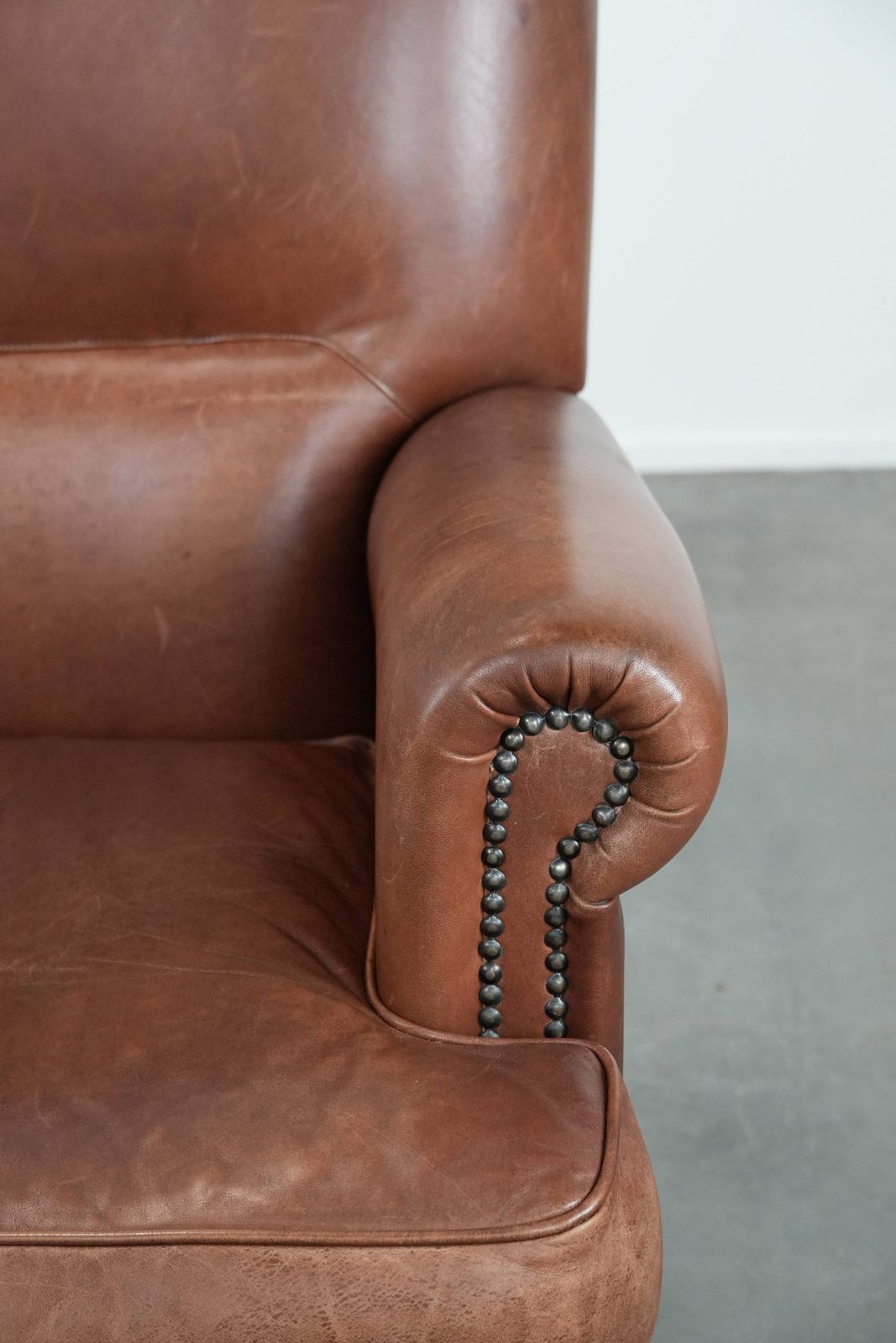 photo furniture Nice And Comfortable Armchair Made Of Cognac Colored Cowhide In English Style