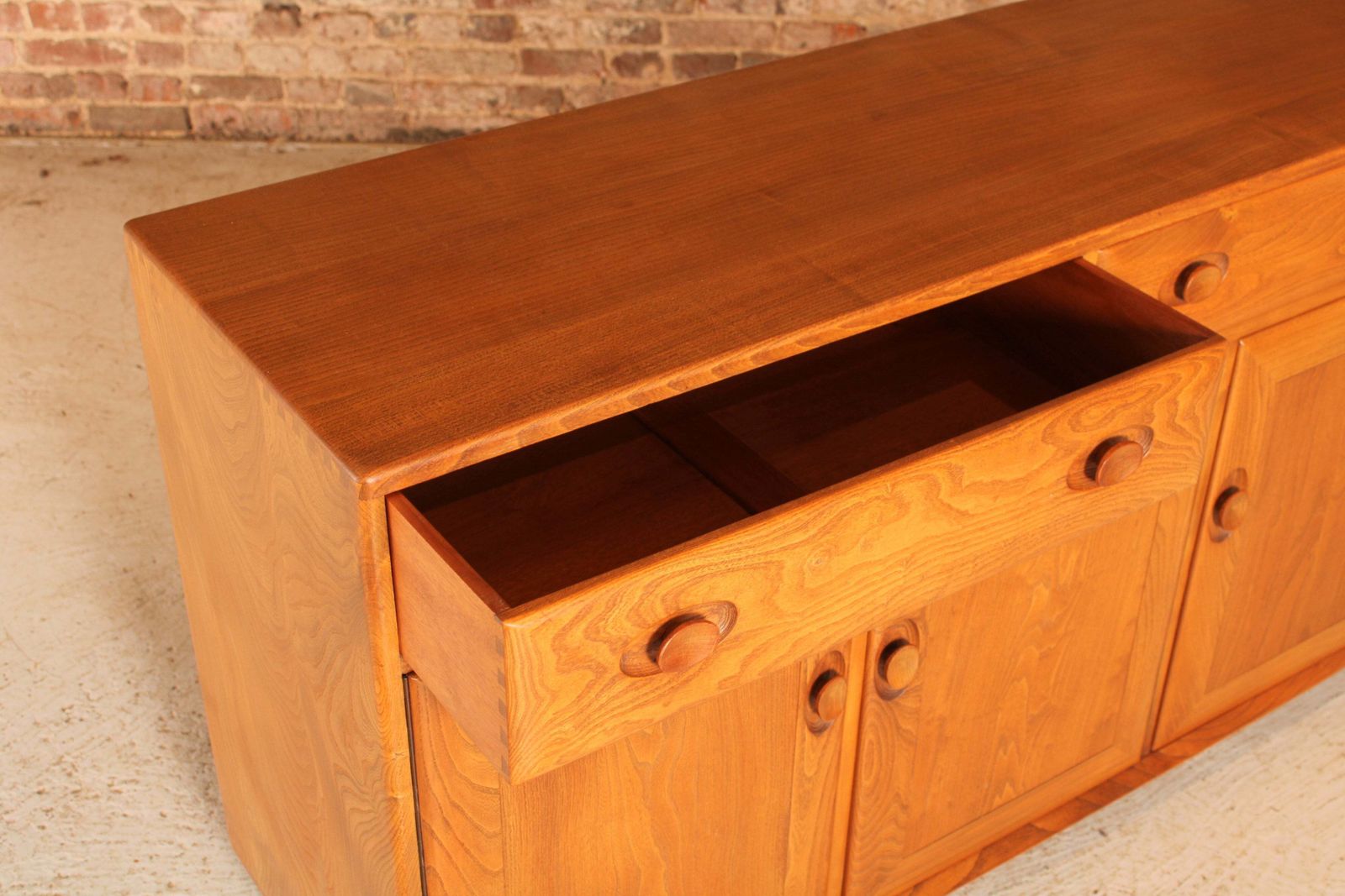 Mid Century Ercol Windsor Solid Elm Sideboard On Casters, Circa 1960s photo vintage