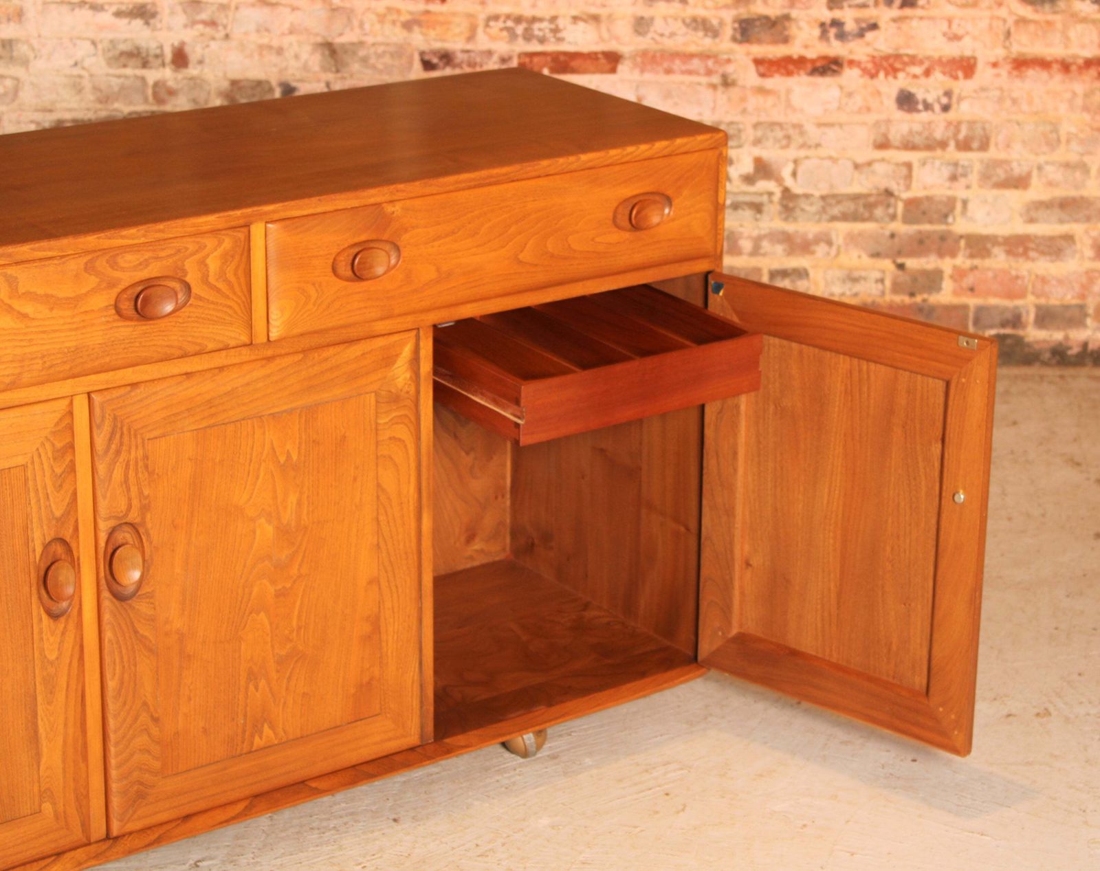 photo for sale Mid Century Ercol Windsor Solid Elm Sideboard On Casters, Circa 1960s