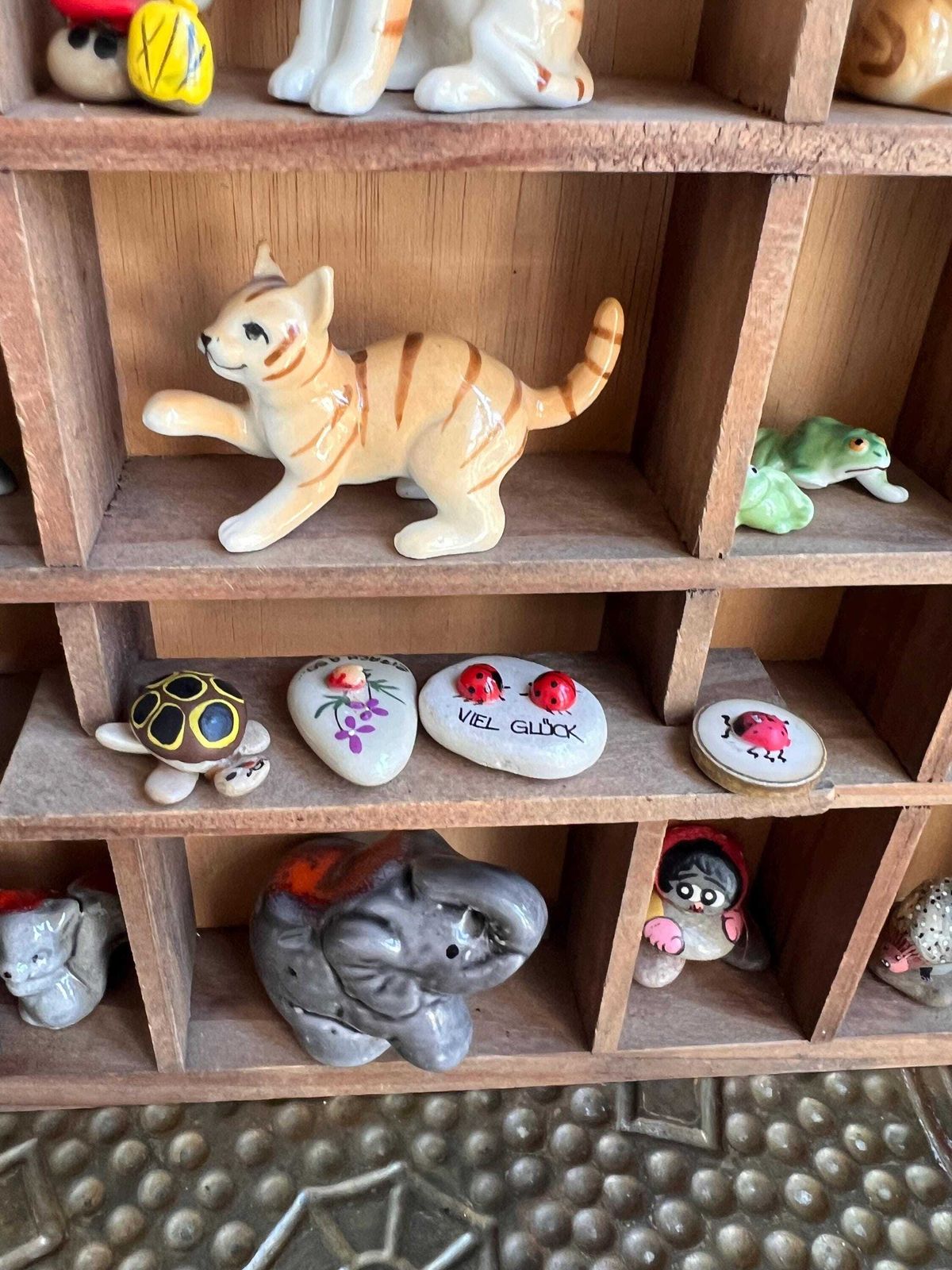 photo vinterior Vintage Curios Cabinet Filled With Miniature Figurines