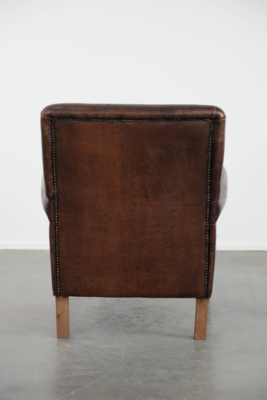 Characterful Sheepskin Armchair With A Beautiful Deep Color photo Furniture