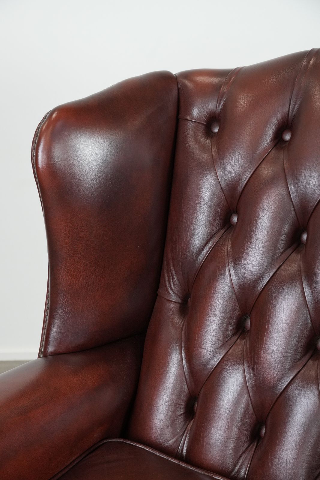 photo for sale Classic And Elegant English Style Cowhide Chesterfield Wing Chair In A Beautiful, Luxurious Red Color
