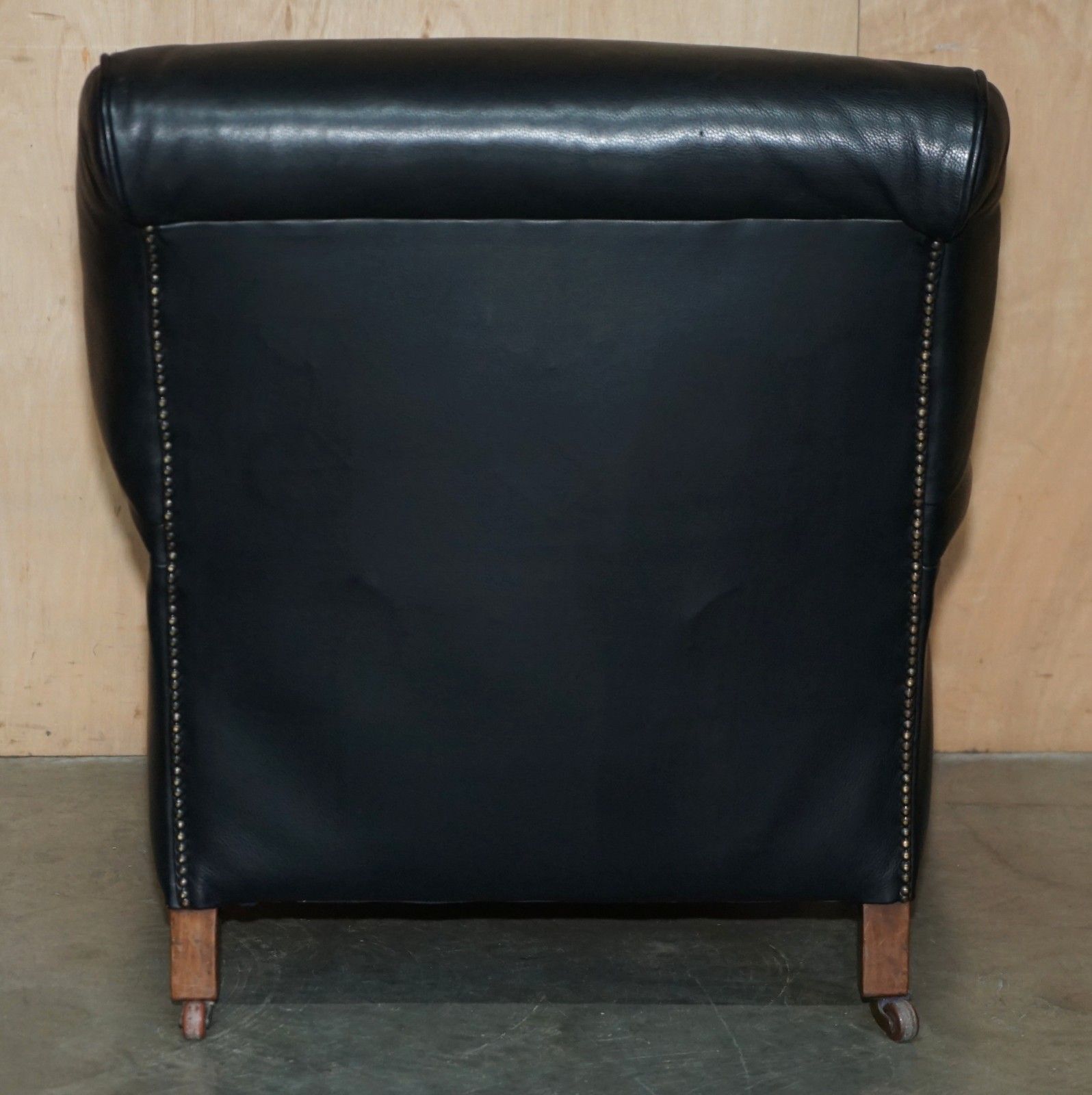 photo vinterior Oversized Antique Victorian Black Leather Club Armchair Stamped Inside Back Leg