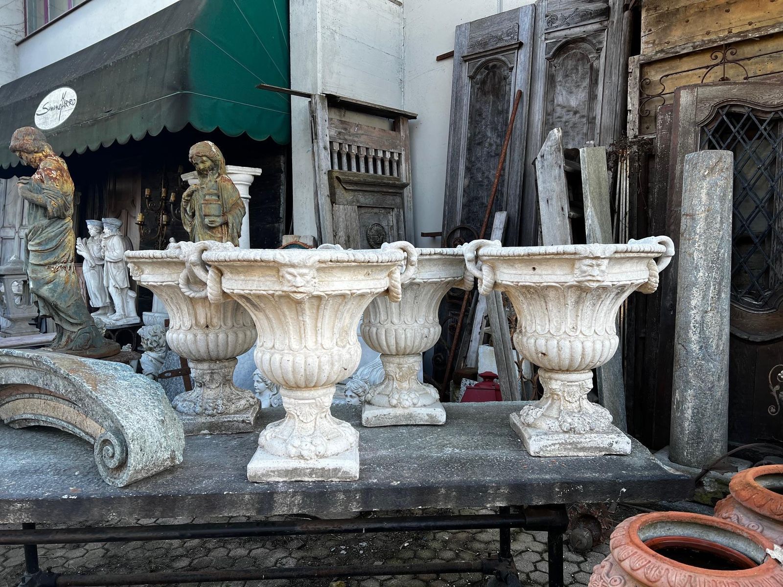 Set Of 4 Composite Stone Bowl Vases With Masks And Carved Decorations photo for sale