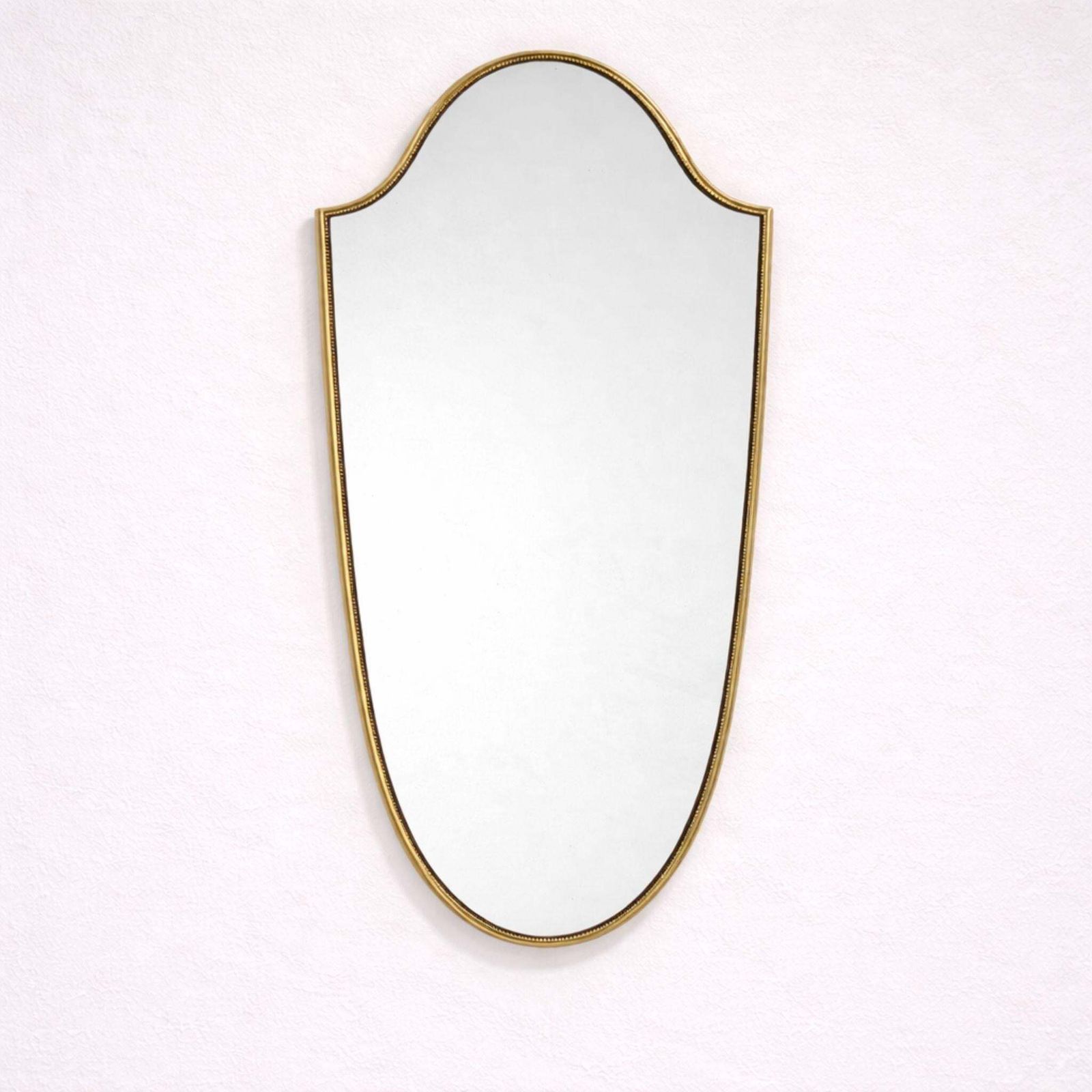 1950s Mid Century Modern Italian Brass Shield Shaped Mirror In The Style Of Gio photo vinterior