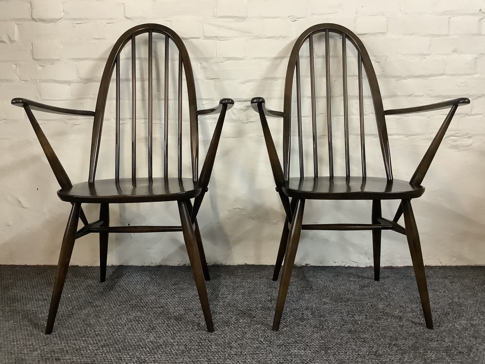 photo furniture A Match Pair Of Ercol Windsor Quaker Back Carver Chairs.